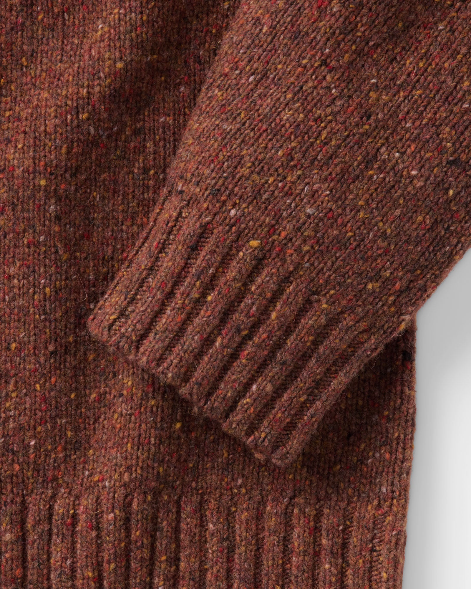 material shot of the sleeve on The Seafarer Crew Sweater in Ember Donegal, Sweaters by Taylor Stitch