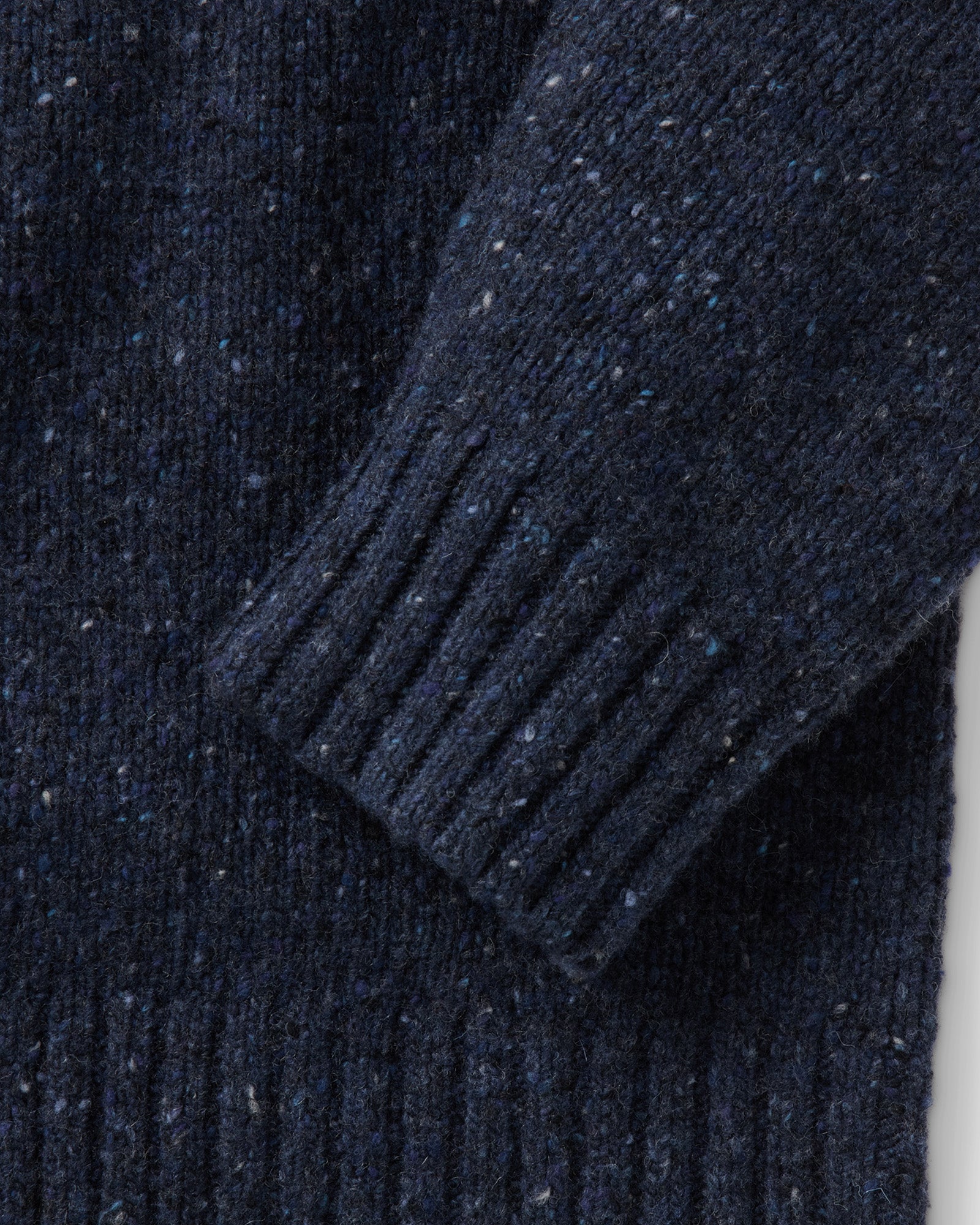 material shot of the sleeve on The Seafarer Crew Sweater in Atlantic Blue Donegal, Sweaters by Taylor Stitch