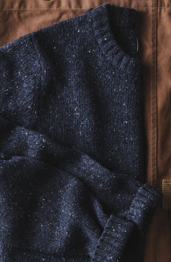 editorial flatlay of The Seafarer Crew Sweater in Atlantic Blue Donegal