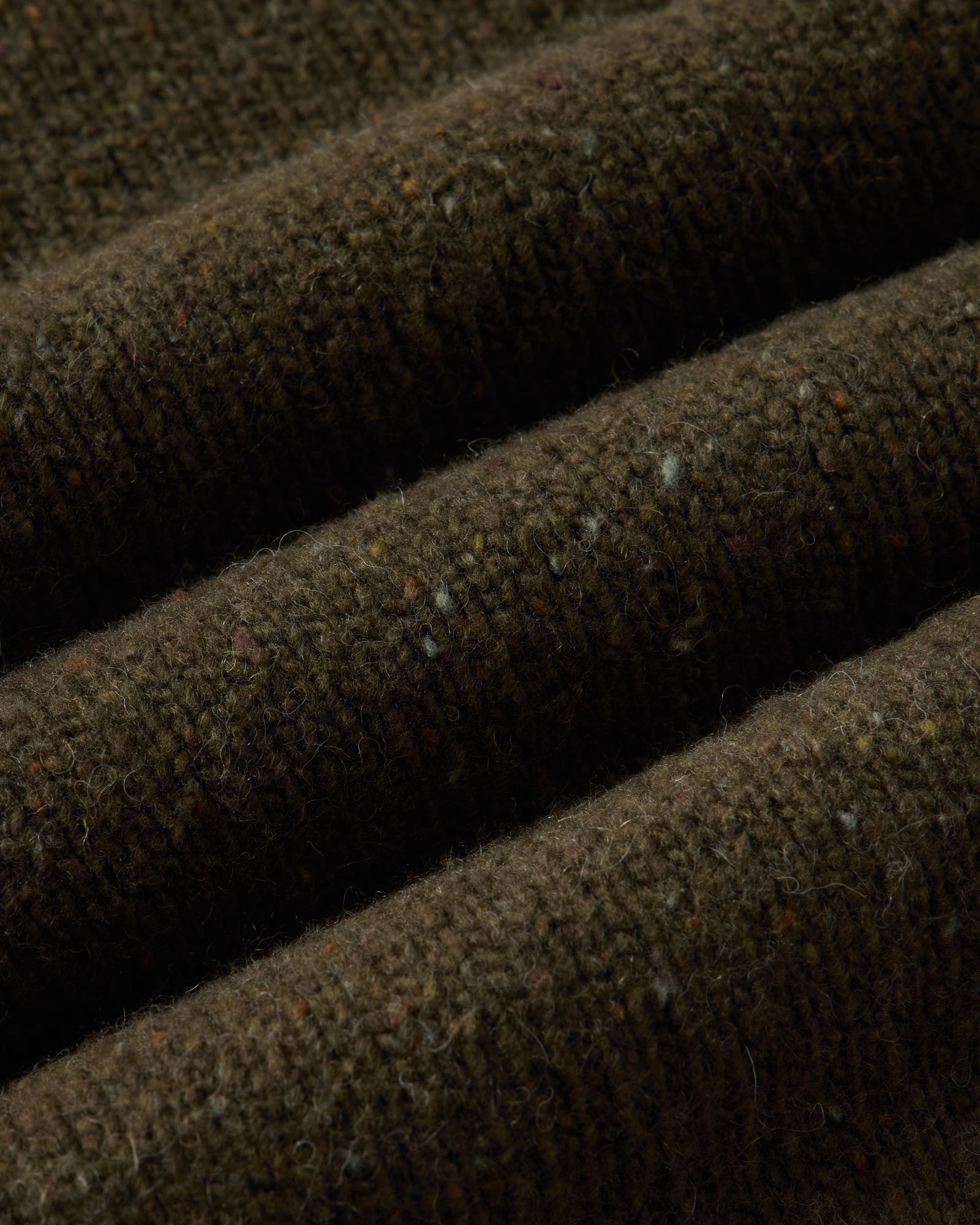 material shot of the fabric on The Seafarer Rollneck Sweater in Olive Donegal, Sweaters by Taylor Stitch