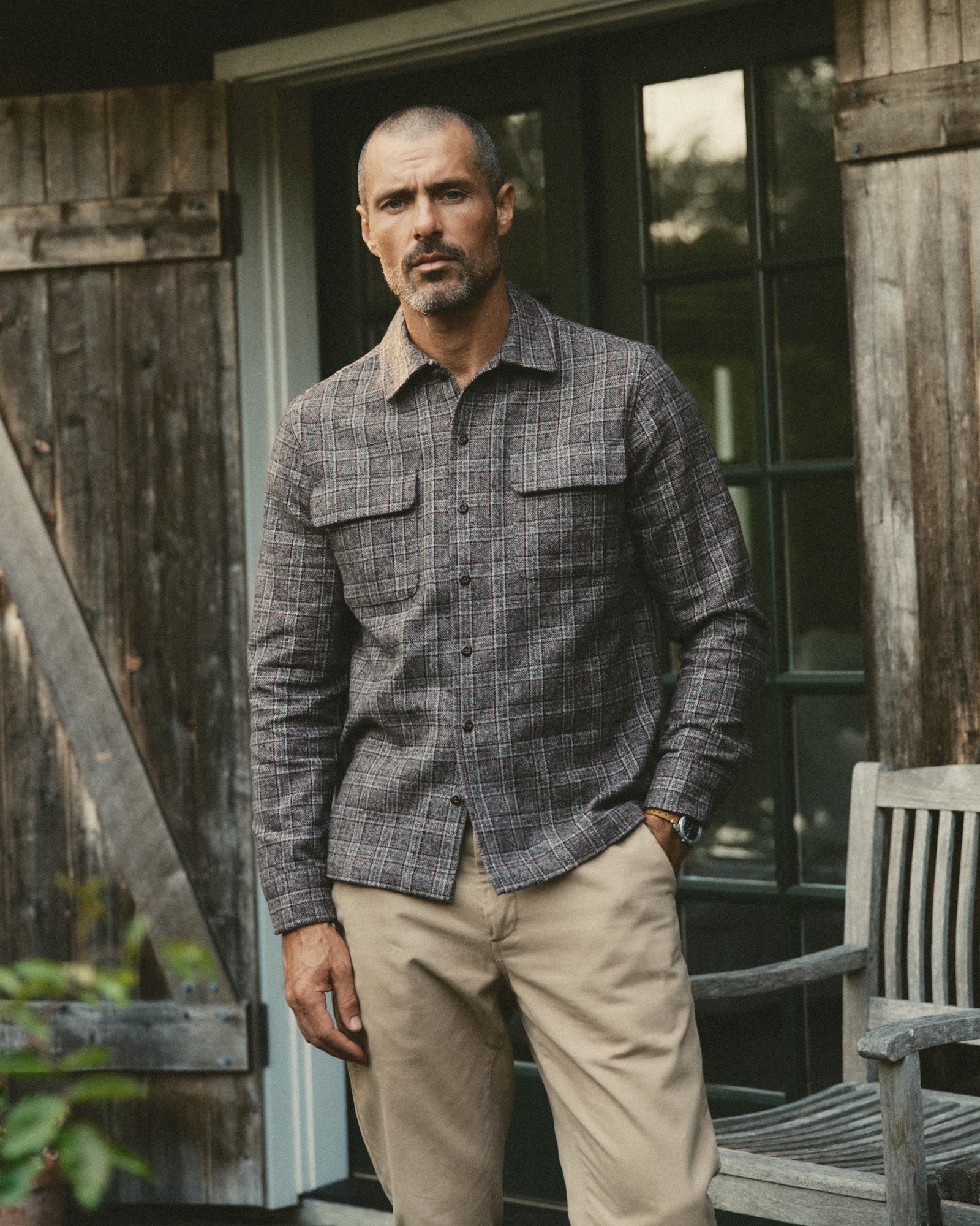 fit model posing in The Shore Shirt in Flint Check Wool, Wovens by Taylor Stitch