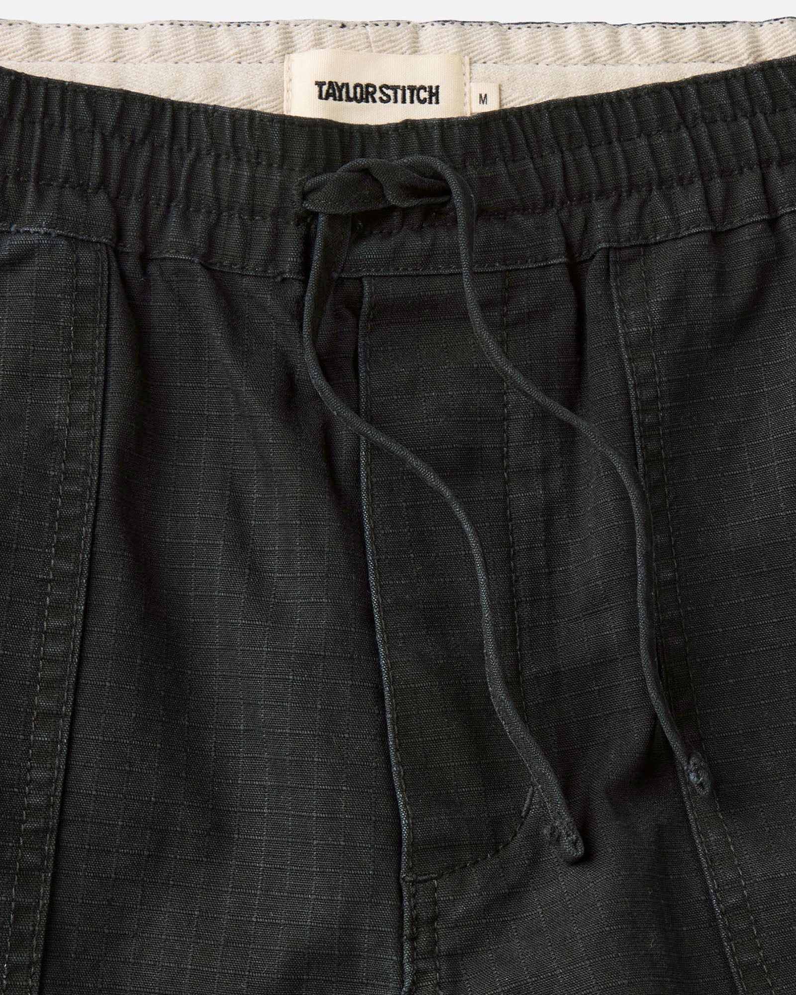 material shot of the waistband on The Breakwater Pant in Coal Ripstop, Bottoms by Taylor Stitch