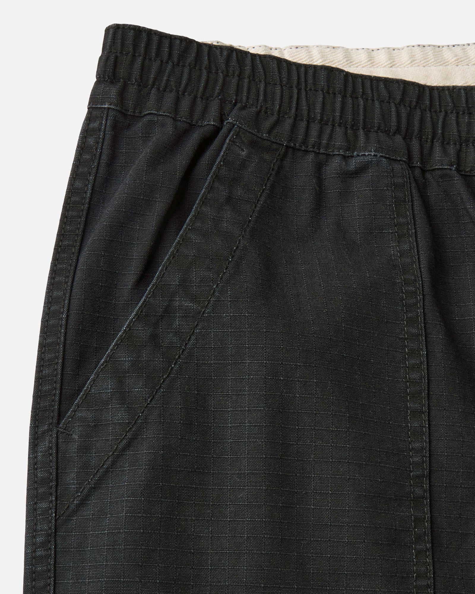 material shot of the pocket on The Breakwater Pant in Coal Ripstop, Bottoms by Taylor Stitch