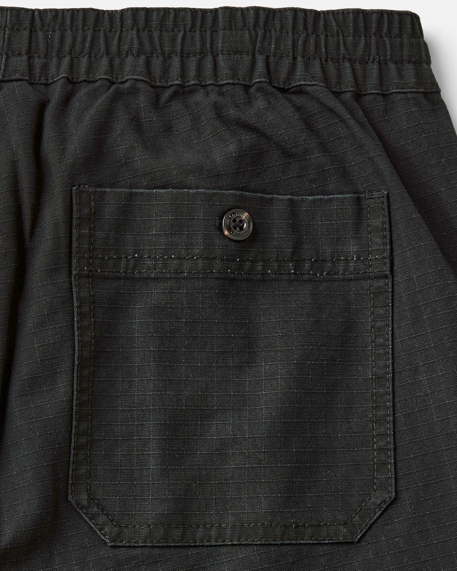 material shot of the back pocket on The Breakwater Pant in Coal Ripstop, Bottoms by Taylor Stitch