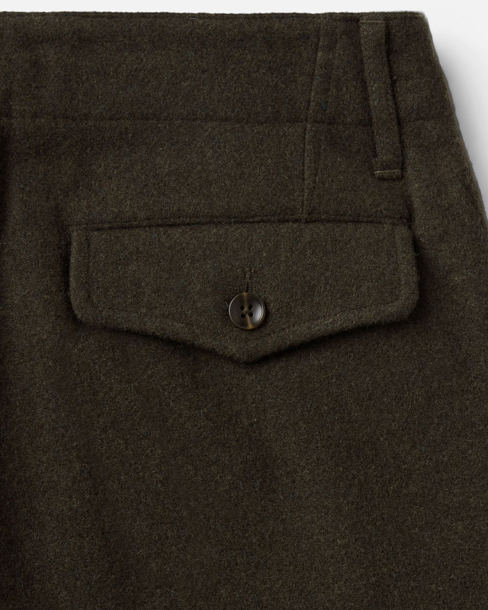 material shot of the back pocket on The Carnegie Pant in Army Herringbone Wool, Bottoms by Taylor Stitch