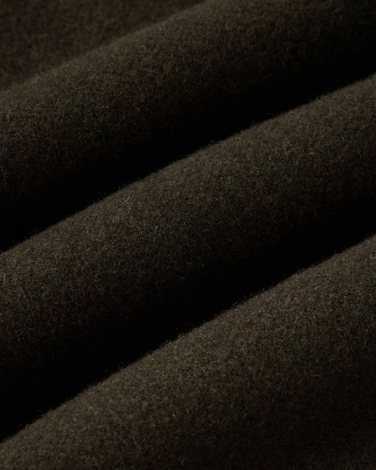 material shot of the fabric on The Carnegie Pant in Army Herringbone Wool, Bottoms by Taylor Stitch