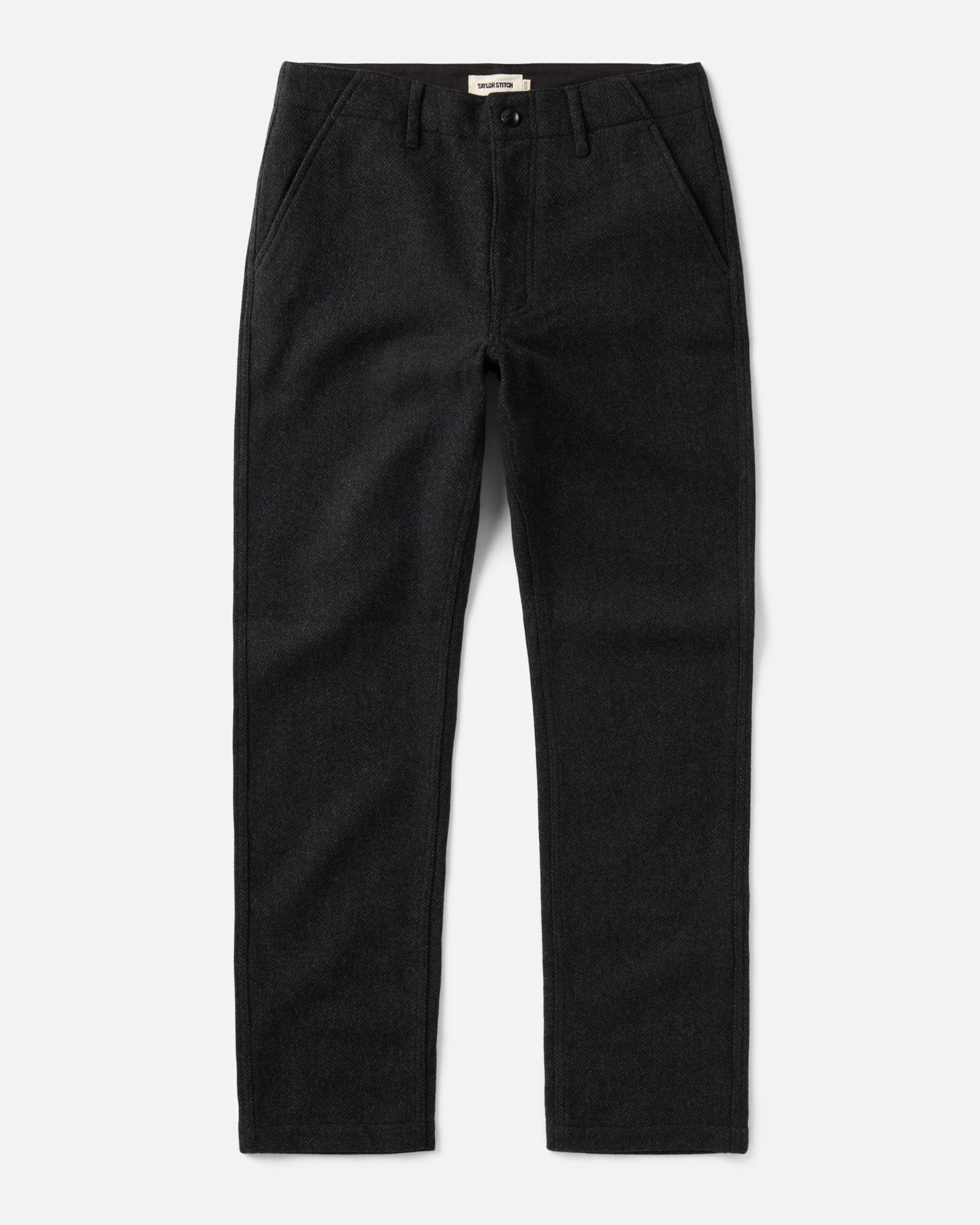 flatlay of The Carnegie Pant in Coal Herringbone Wool, Bottoms by Taylor Stitch