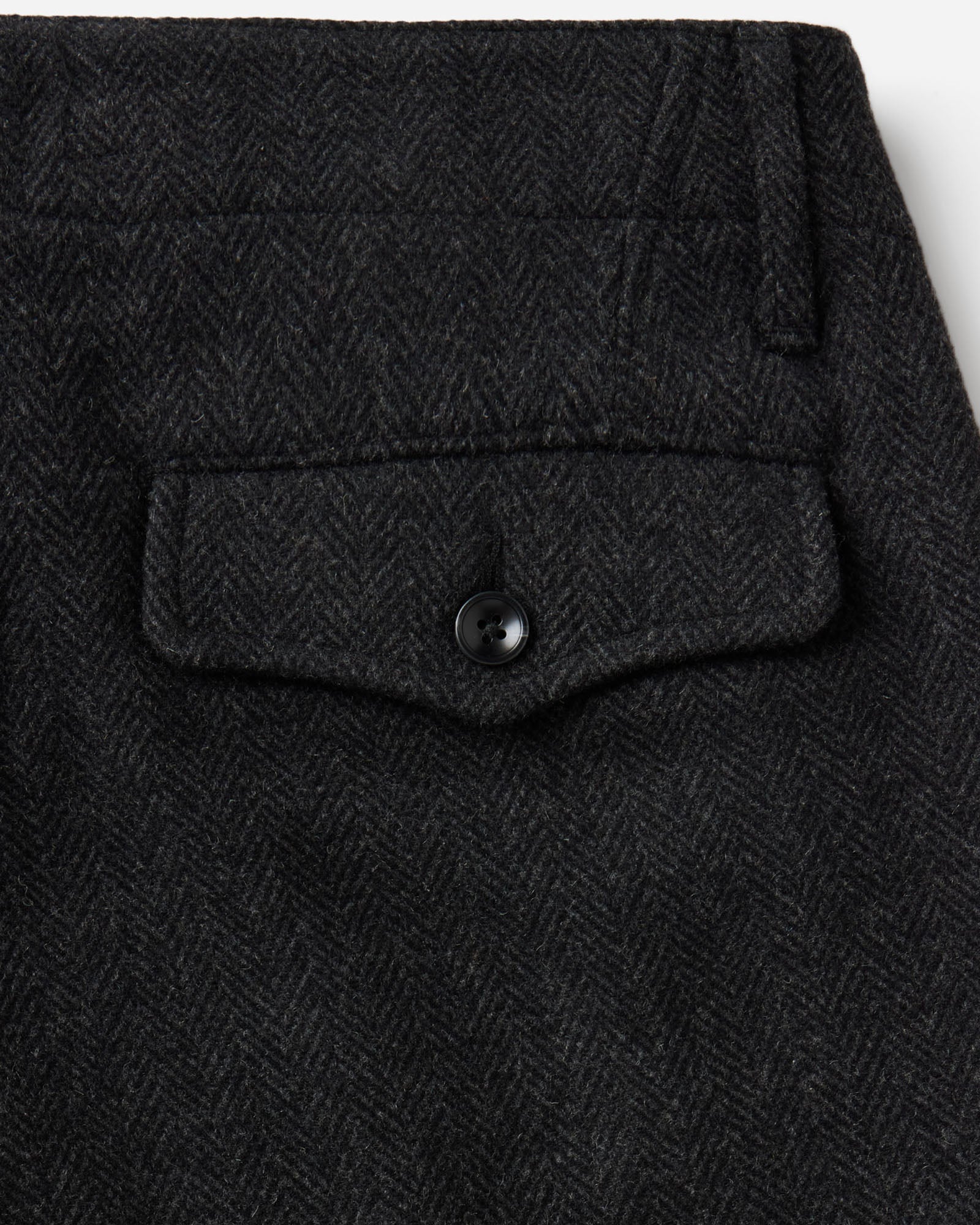 material shot of the back pocket on The Carnegie Pant in Coal Herringbone Wool, Bottoms by Taylor Stitch