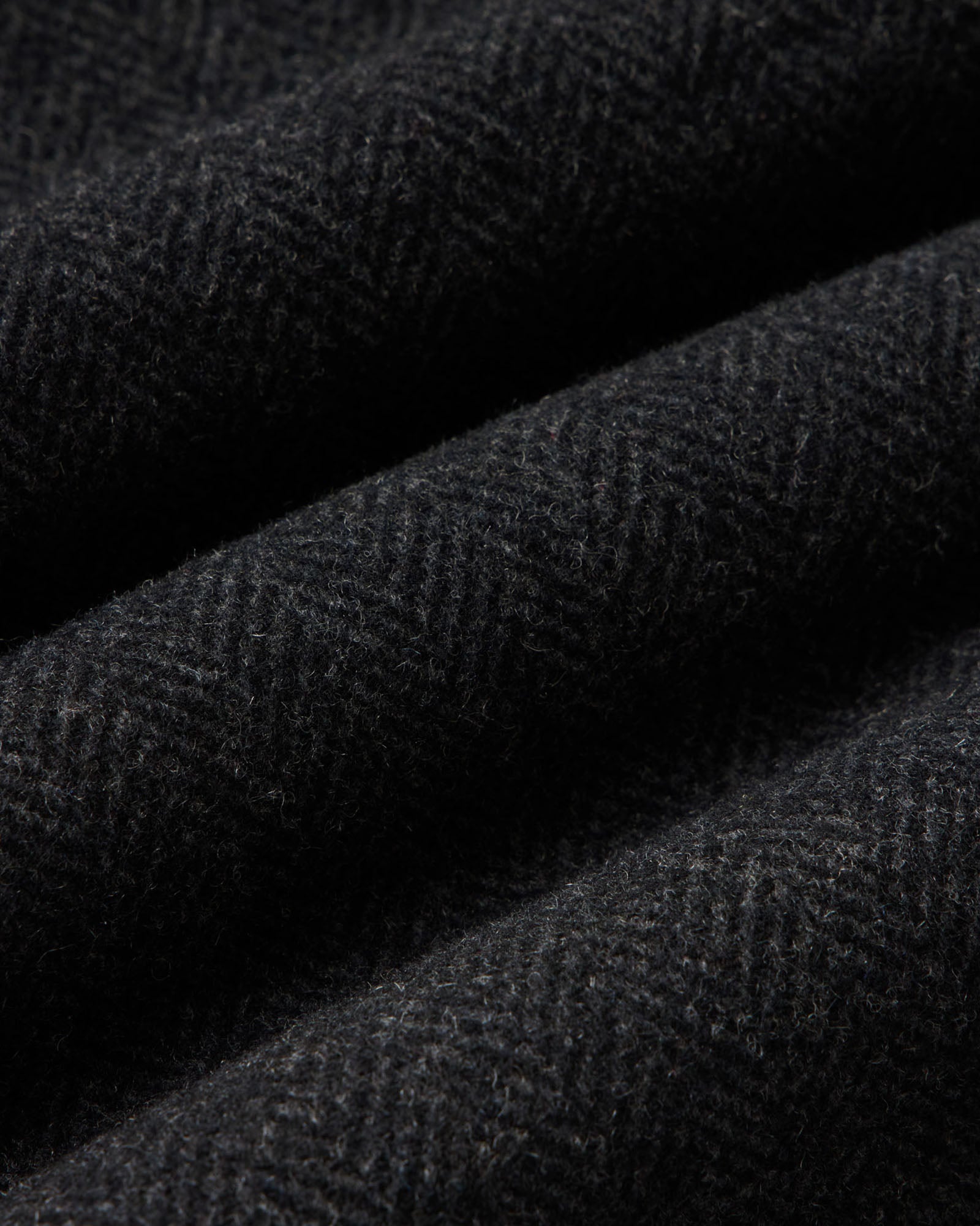 material shot of the fabric on The Carnegie Pant in Coal Herringbone Wool, Bottoms by Taylor Stitch