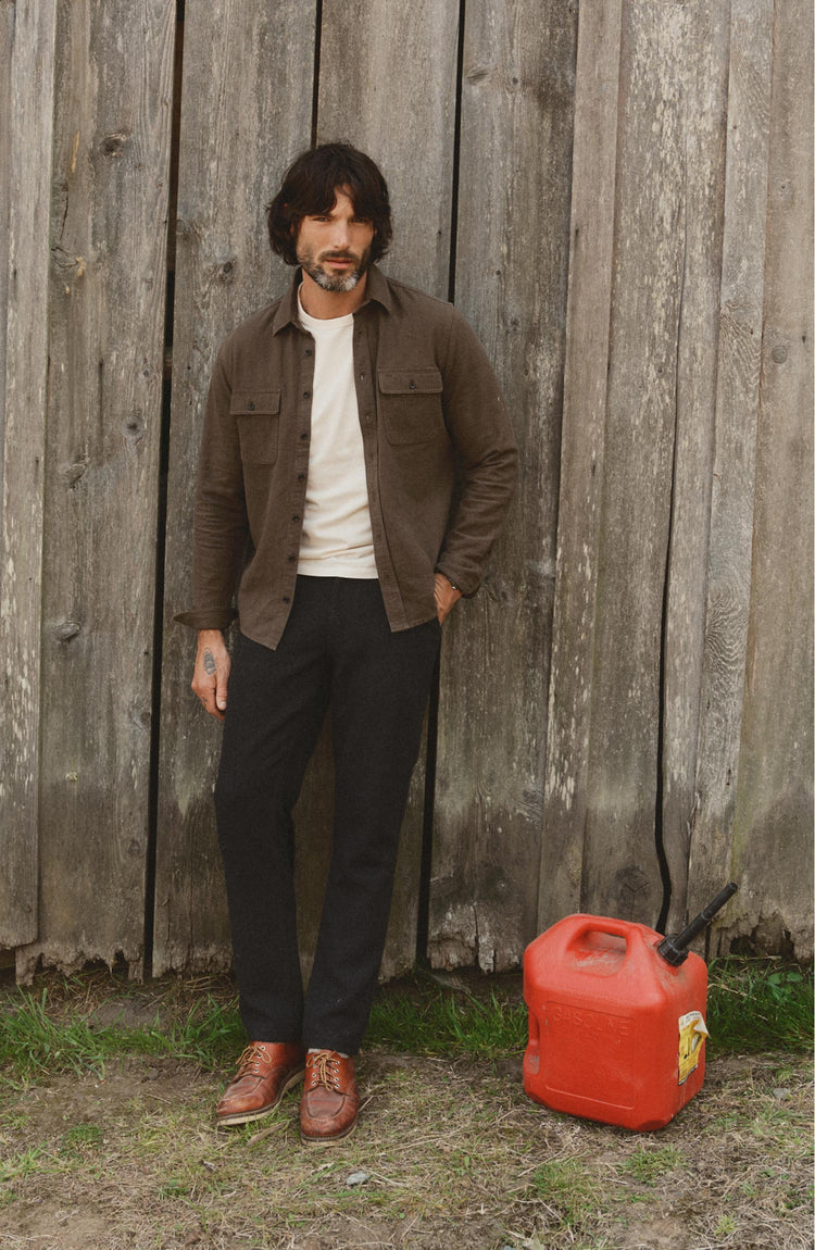 fit model posing in The Carnegie Pant in Coal Herringbone Wool