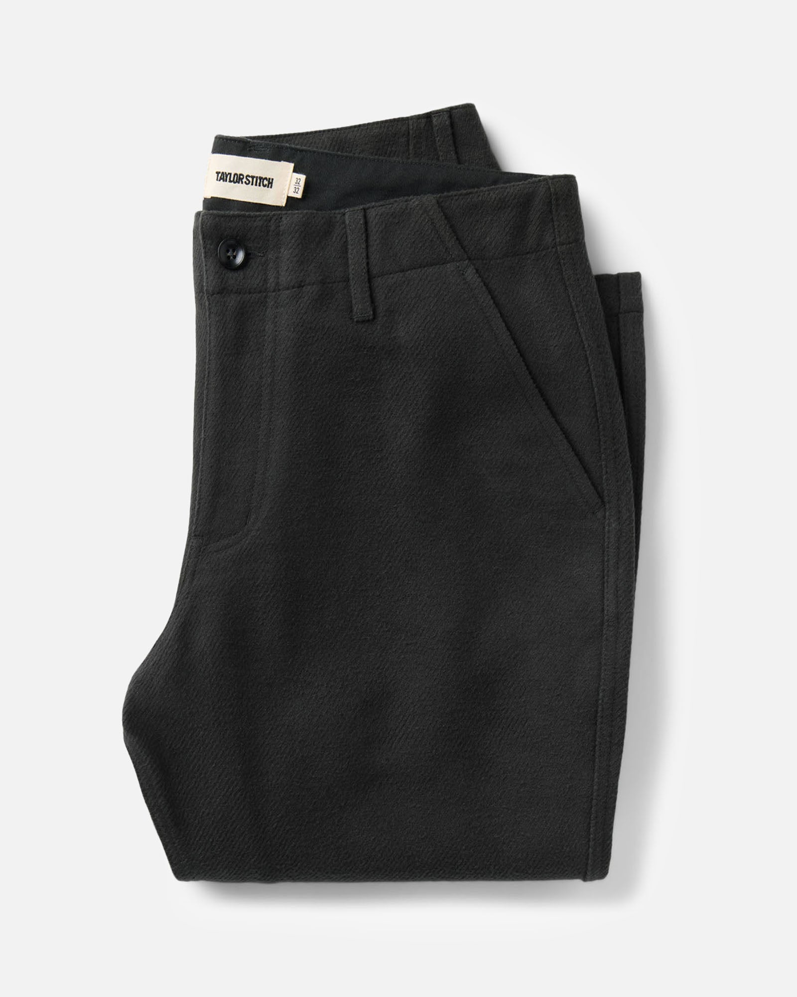 folded flatlay of The Carnegie Pant in Faded Black Washed Moleskin, Bottoms by Taylor Stitch