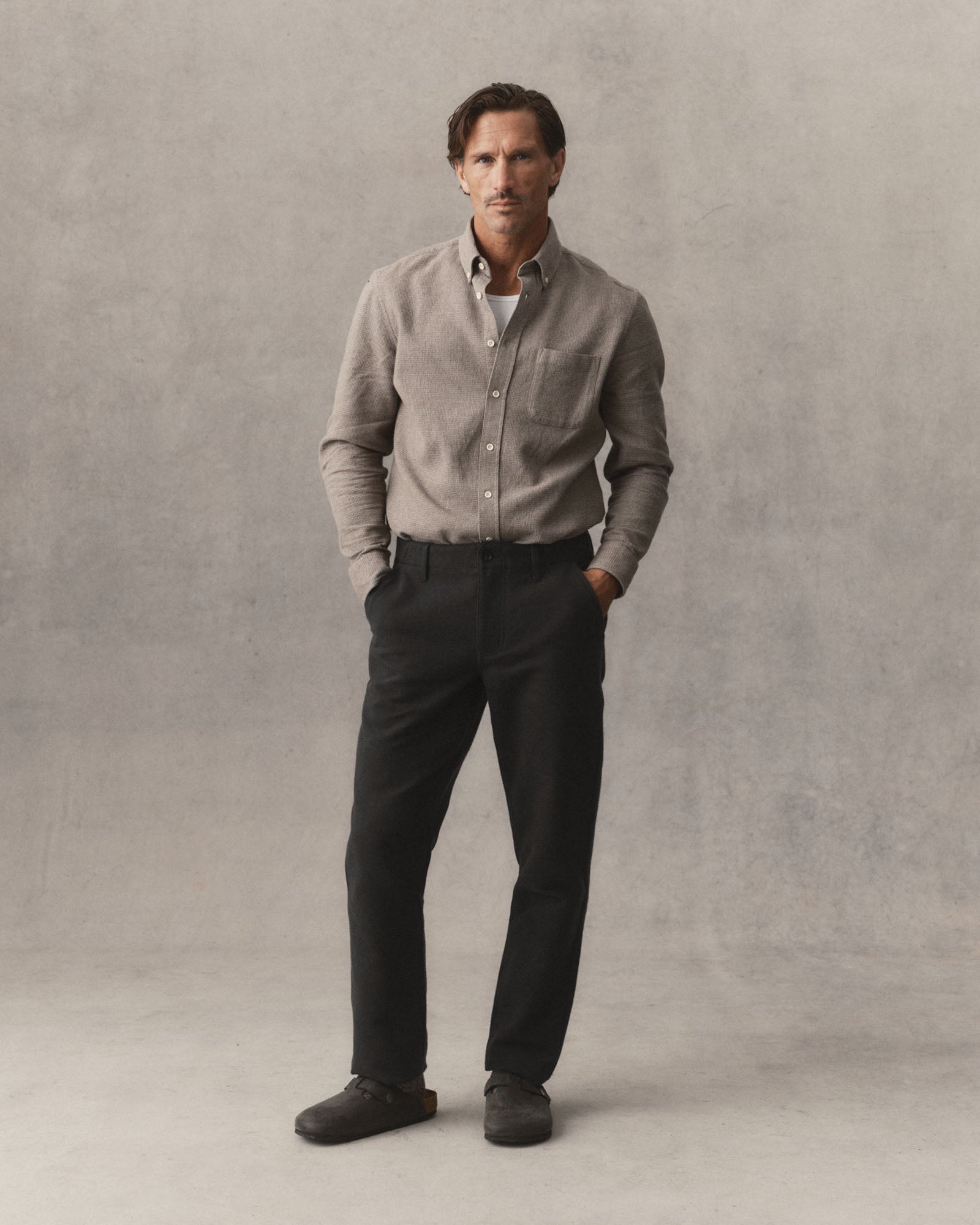 fit model showing off The Carnegie Pant in Faded Black Washed Moleskin, Bottoms by Taylor Stitch