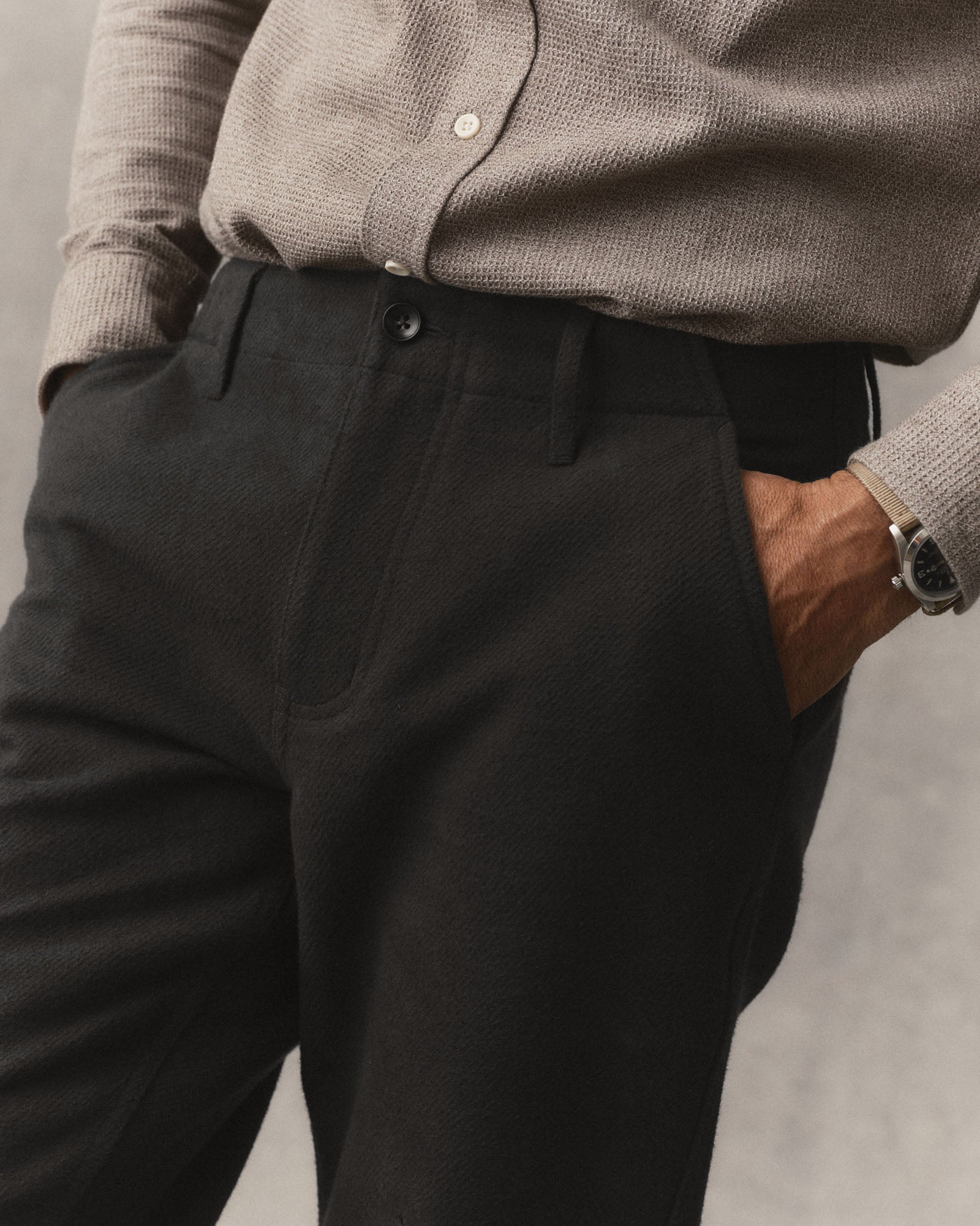 fit model with his hands in the pockets of The Carnegie Pant in Faded Black Washed Moleskin, Bottoms by Taylor Stitch