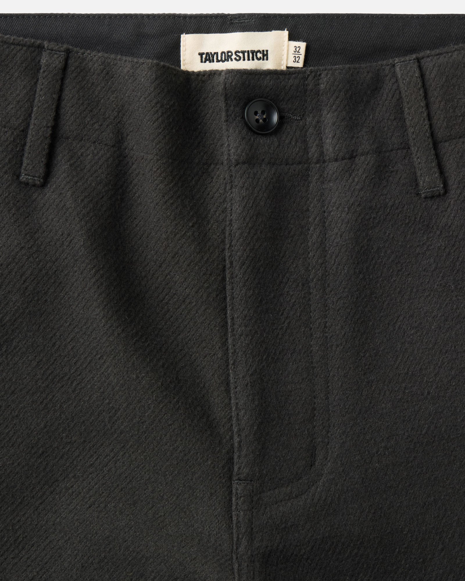material shot of the waistband on The Carnegie Pant in Faded Black Washed Moleskin, Bottoms by Taylor Stitch