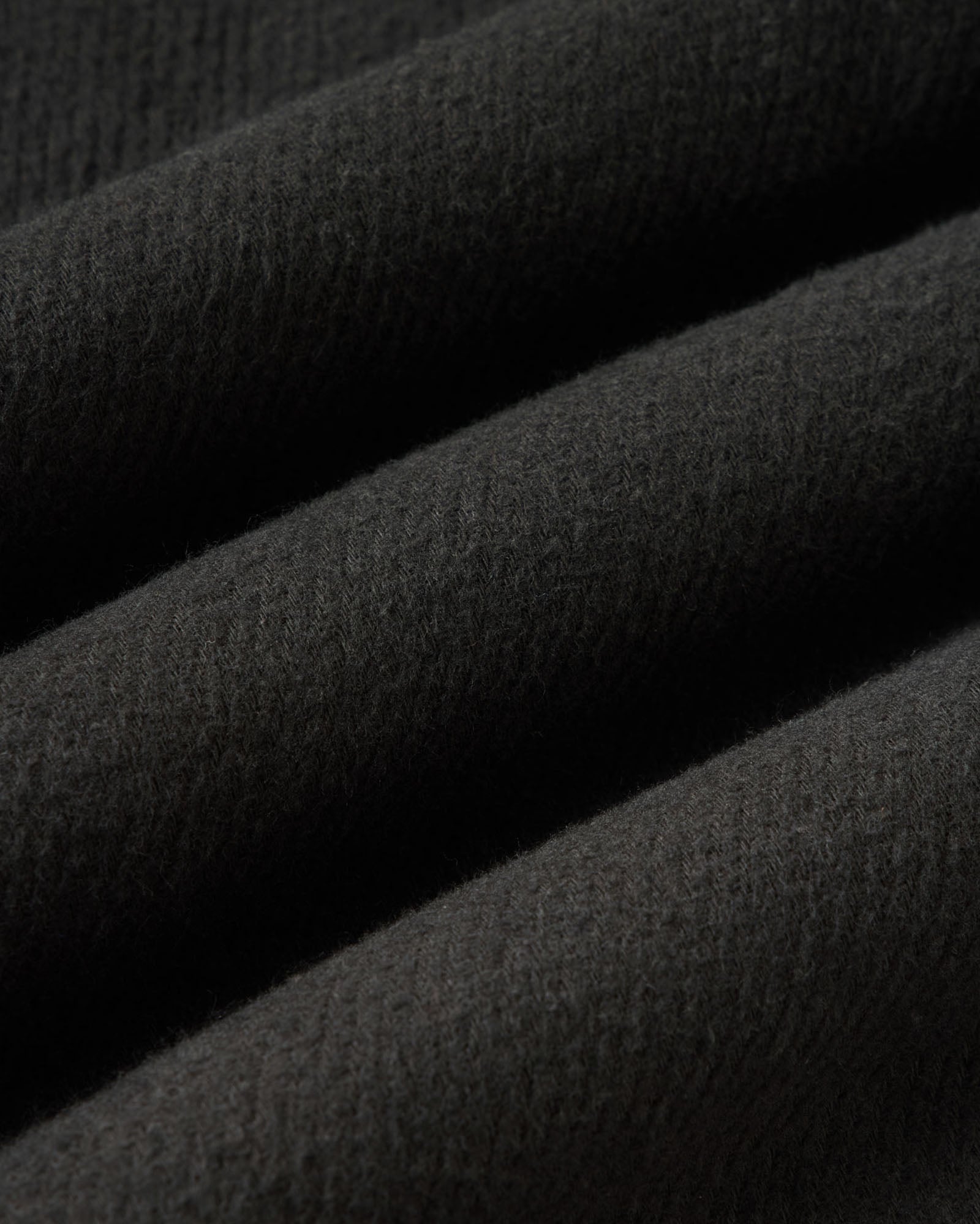 material shot of the fabric on The Carnegie Pant in Faded Black Washed Moleskin, Bottoms by Taylor Stitch