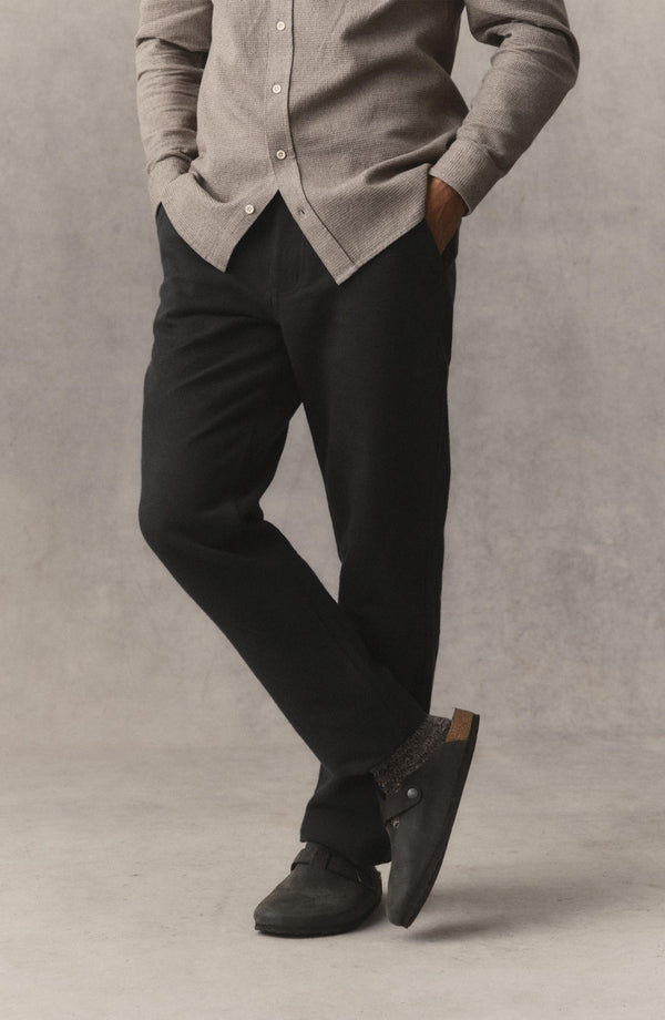 fit model showing off The Carnegie Pant in Faded Black Washed Moleskin