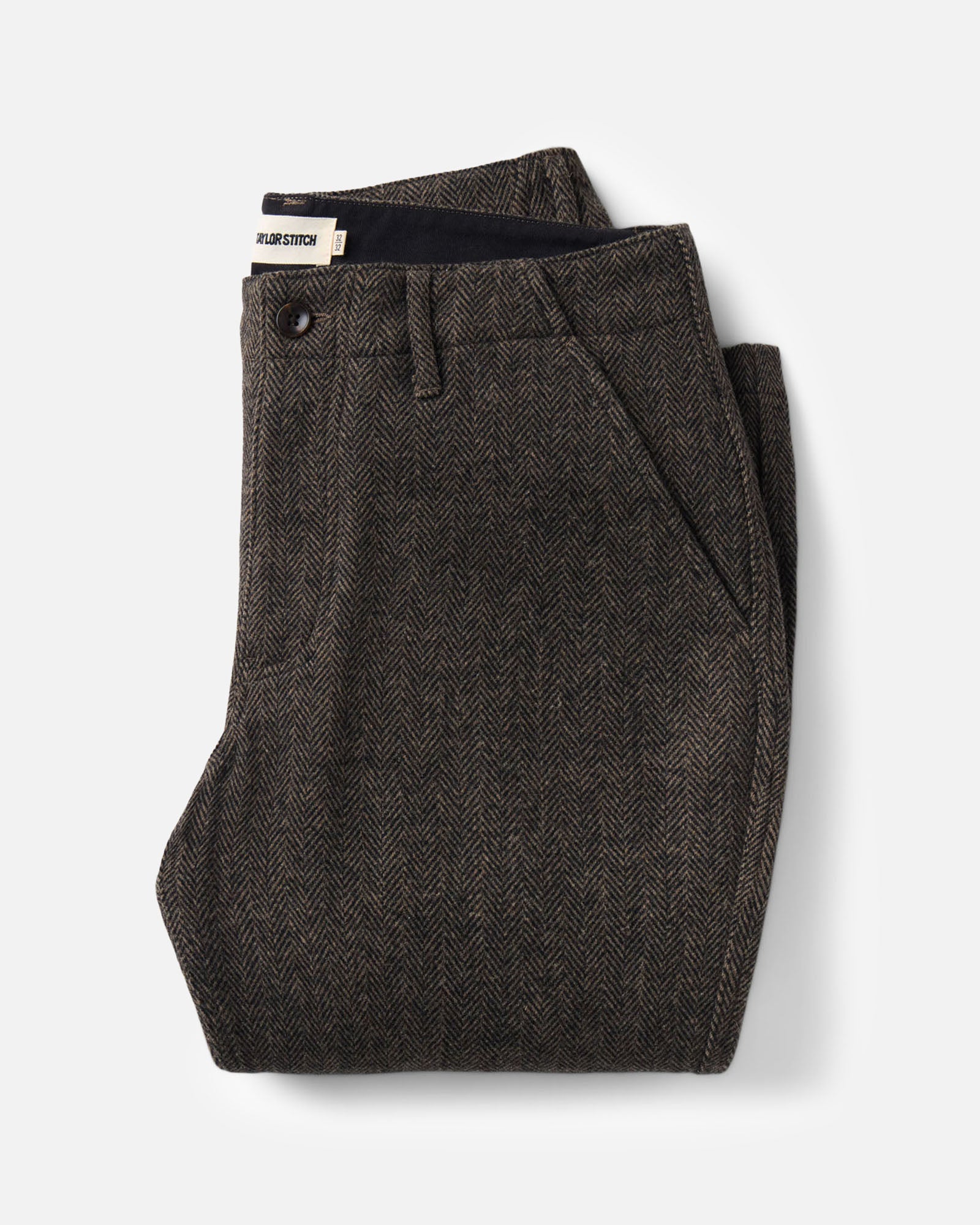folded flatlay of The Carnegie Pant in Walnut Herringbone Wool, Bottoms by Taylor Stitch
