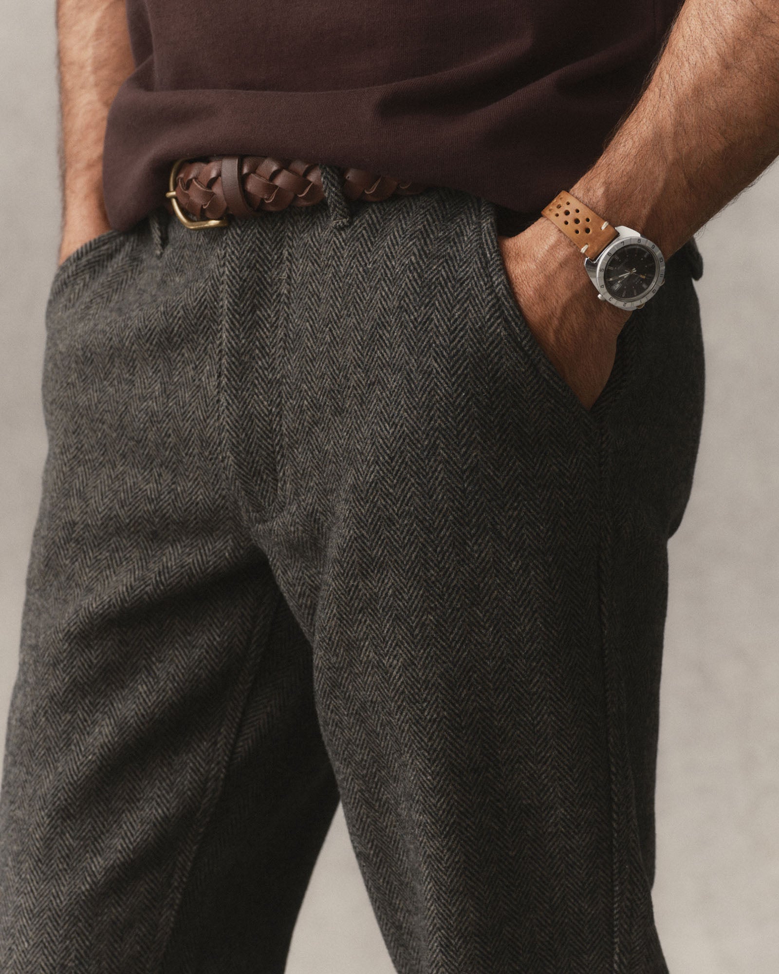 fit model with his hands in the pockets of The Carnegie Pant in Walnut Herringbone Wool, Bottoms by Taylor Stitch