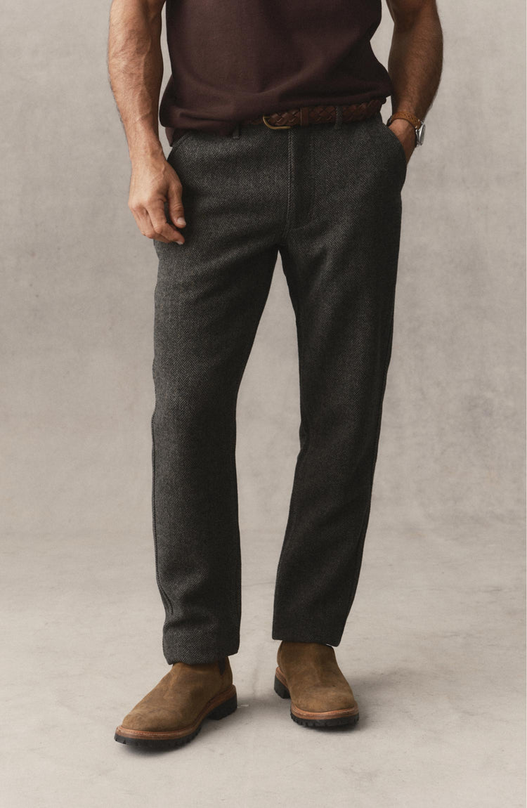 fit model posing in The Carnegie Pant in Walnut Herringbone Wool