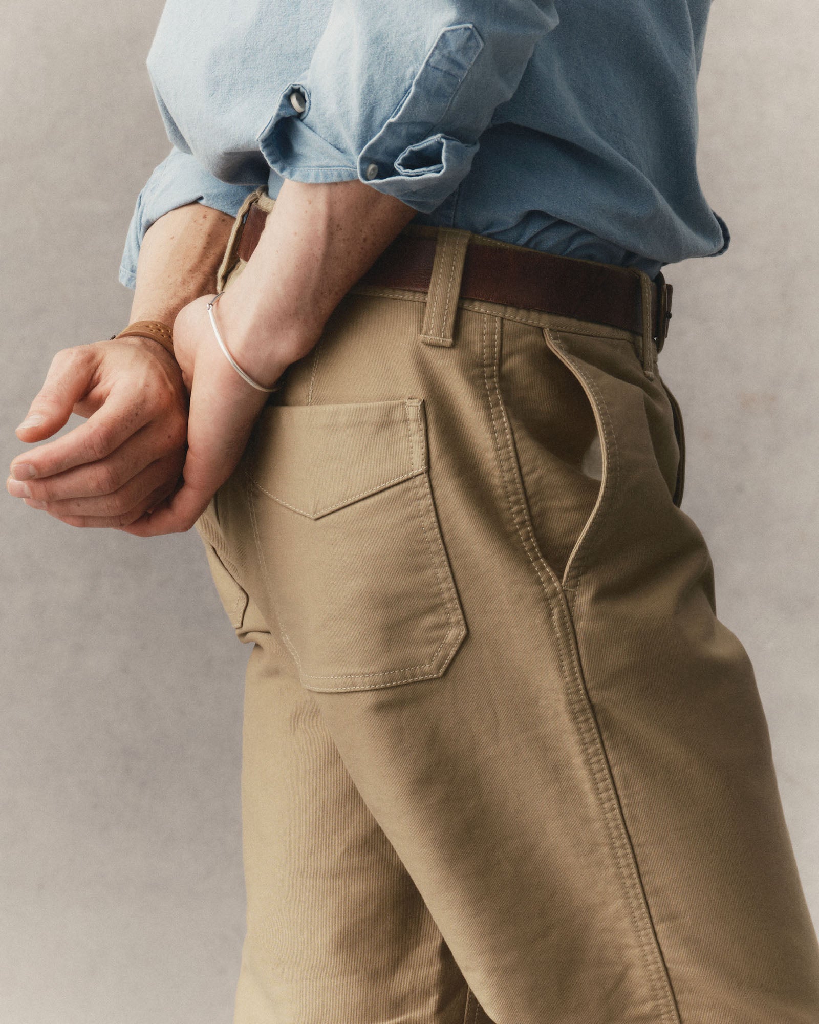 fit modle showing off the back pockets on The Deck Pant in Khaki Bedford Cord, Bottoms by Taylor Stitch