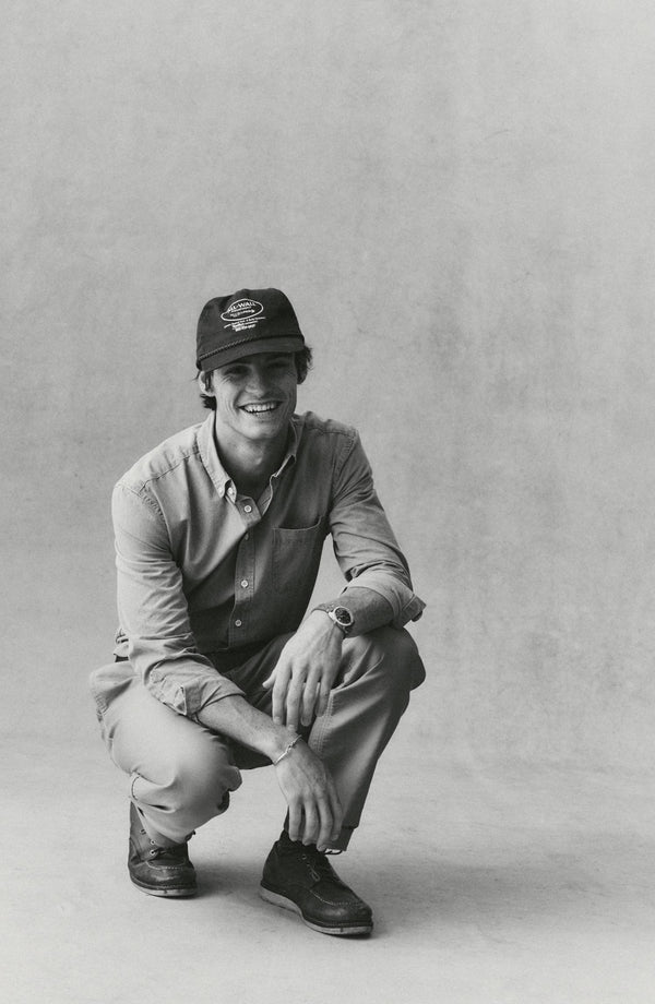 fit model sitting wearing The Deck Pant in Khaki Bedford Cord