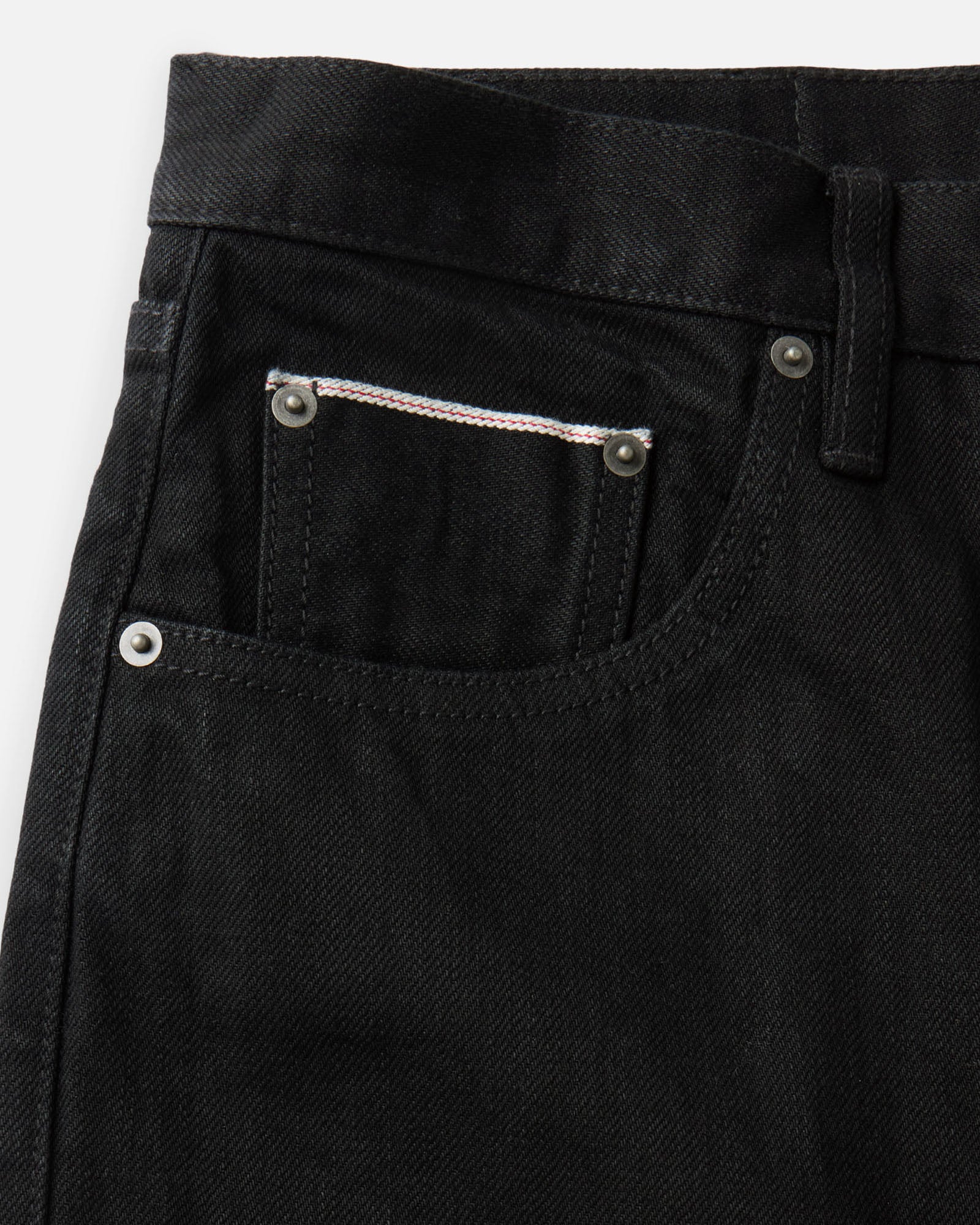 material shot of the pocket on The Democratic Jean in Rinsed Black Organic Selvedge, Bottoms by Taylor Stitch