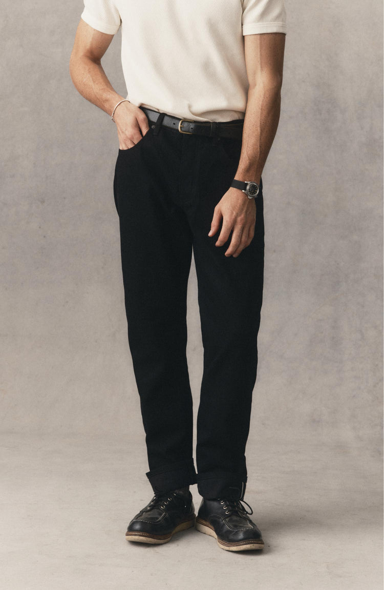 fit model posing in The Democratic Jean in Rinsed Black Organic Selvedge