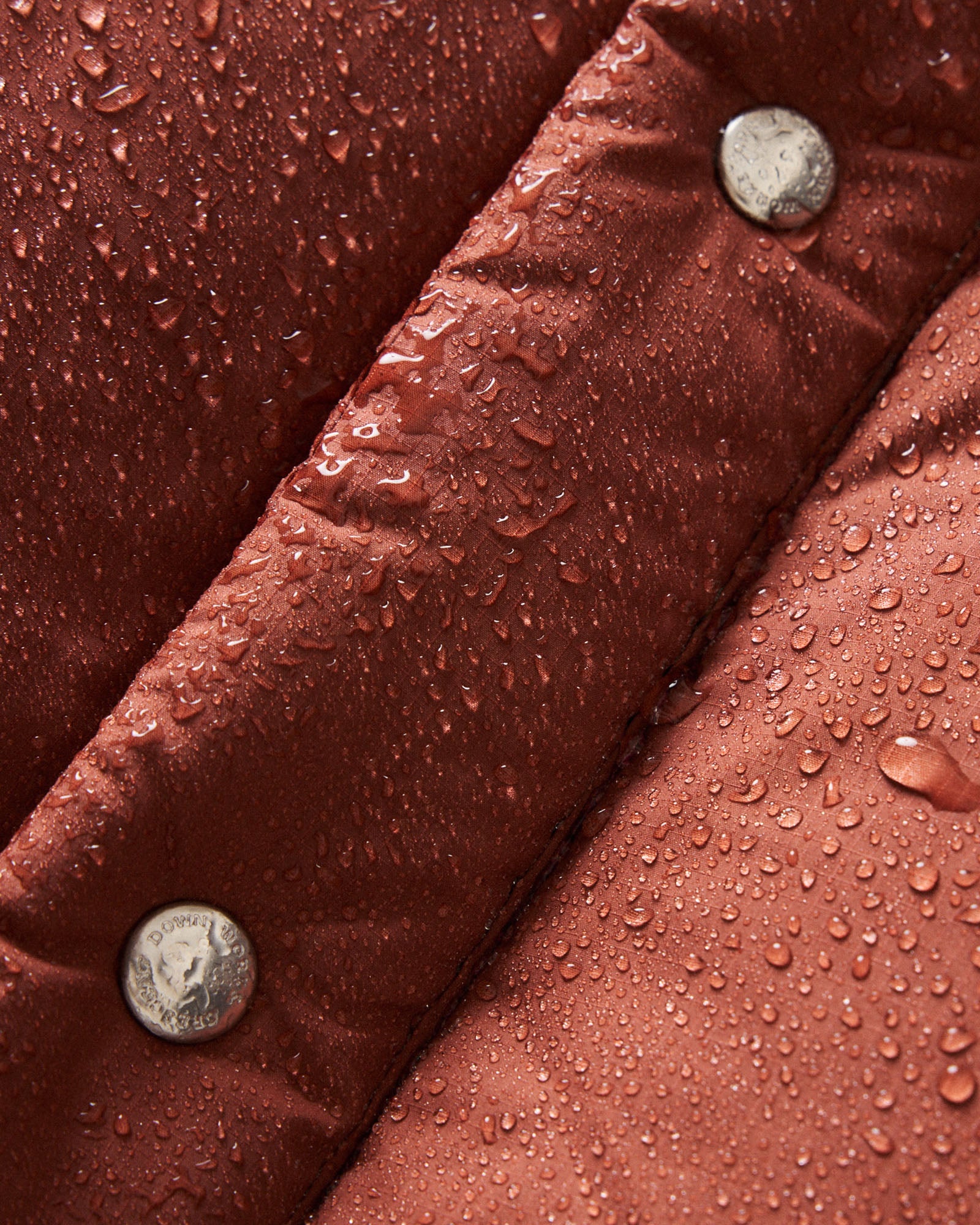 material shot of the hood on The Down Sweater Jacket in Brick Red Waxed Ripstop, Outerwear by Taylor Stitch