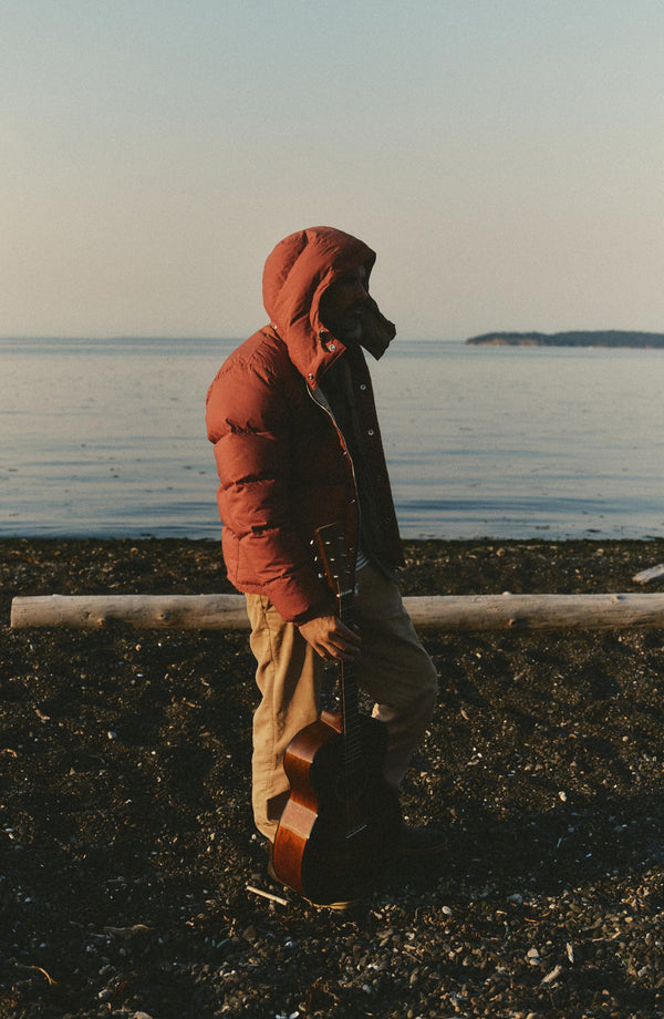 fit model showing off the hood on The Down Sweater Jacket in Brick Red Waxed Ripstop