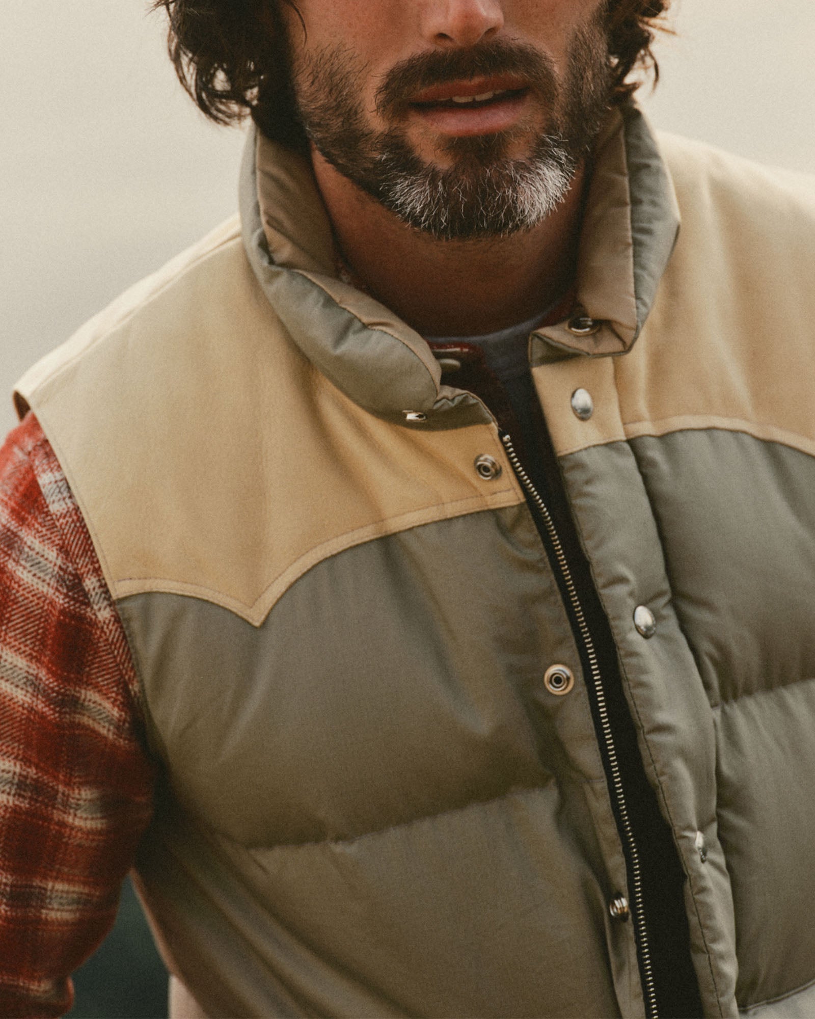 fit model showing off the zipper on The Down Vest in Khaki Waxed Ripstop, Outerwear by Taylor Stitch