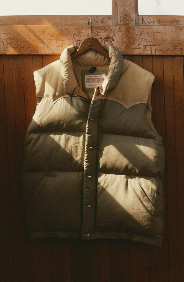 editorial image of The Down Vest in Khaki Waxed Ripstop hanging