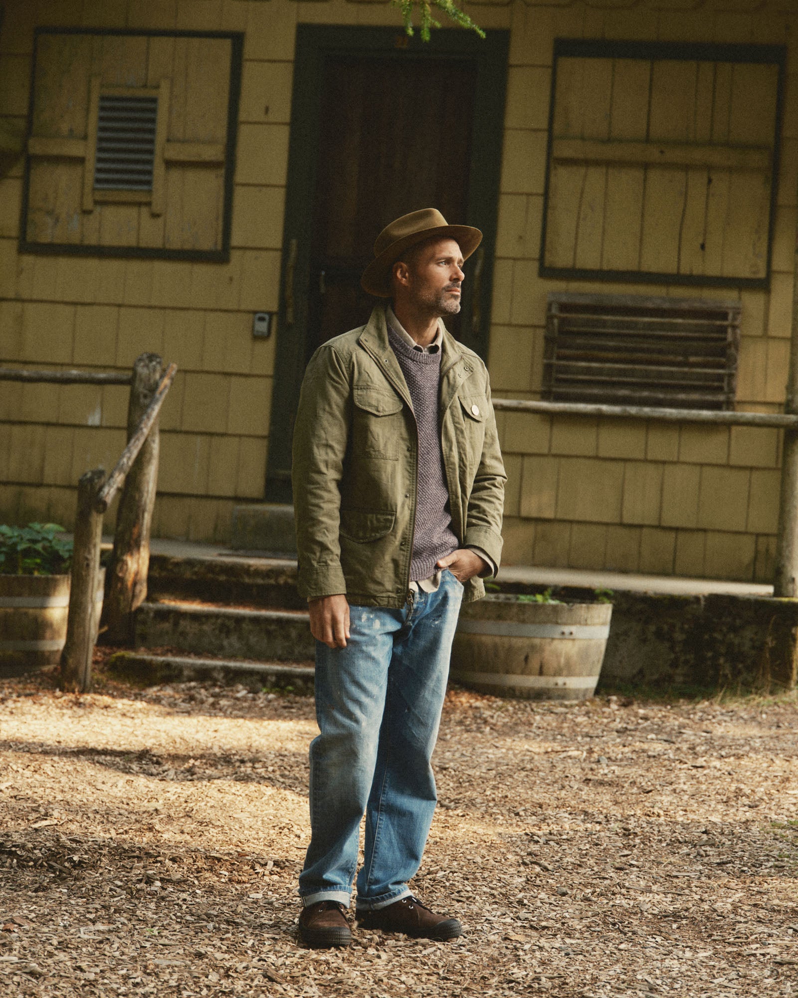 fit model posing in The Field Jacket in Burnt Olive Ripstop, Outerwear by Taylor Stitch