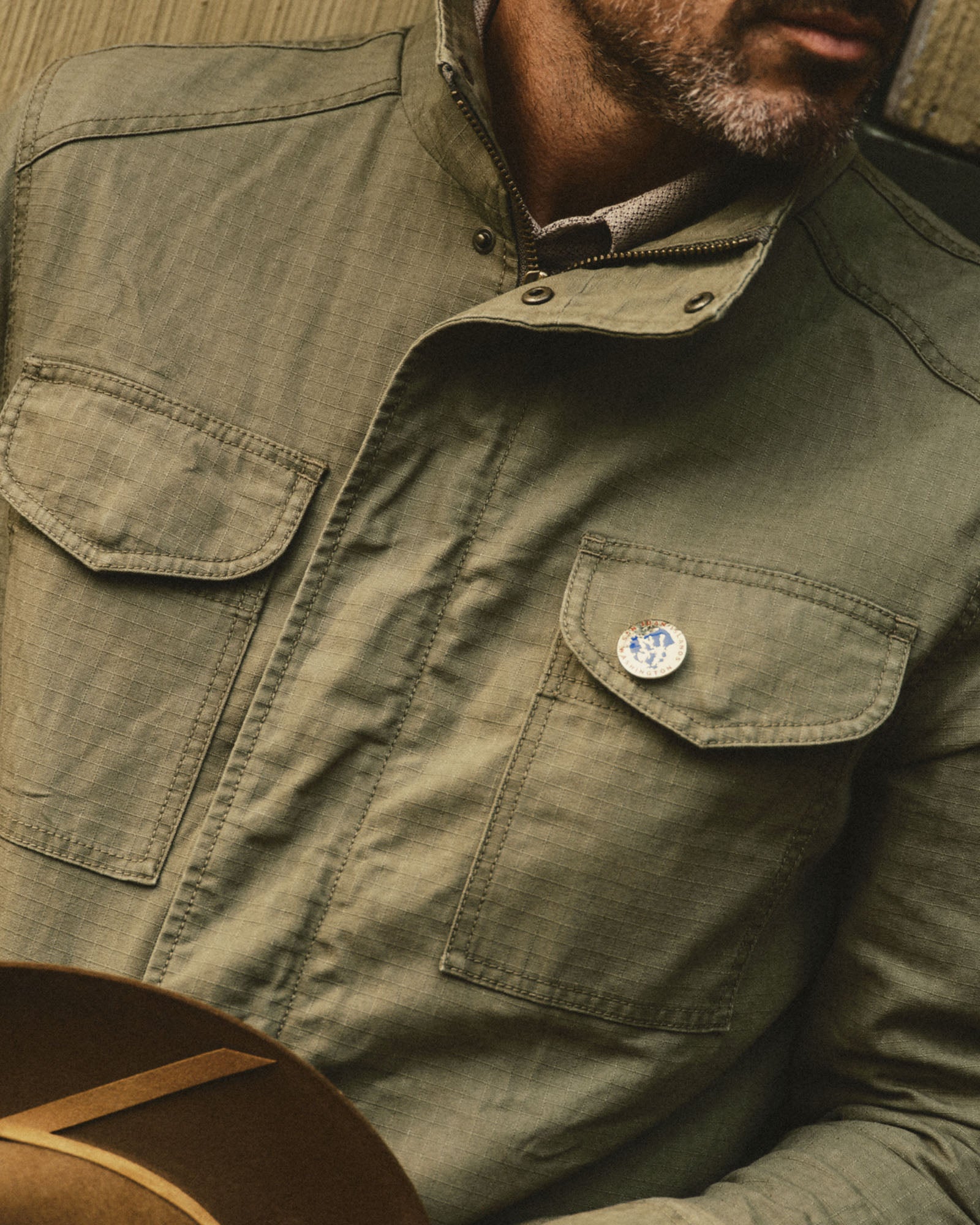fit model showing off the pockets on The Field Jacket in Burnt Olive Ripstop, Outerwear by Taylor Stitch