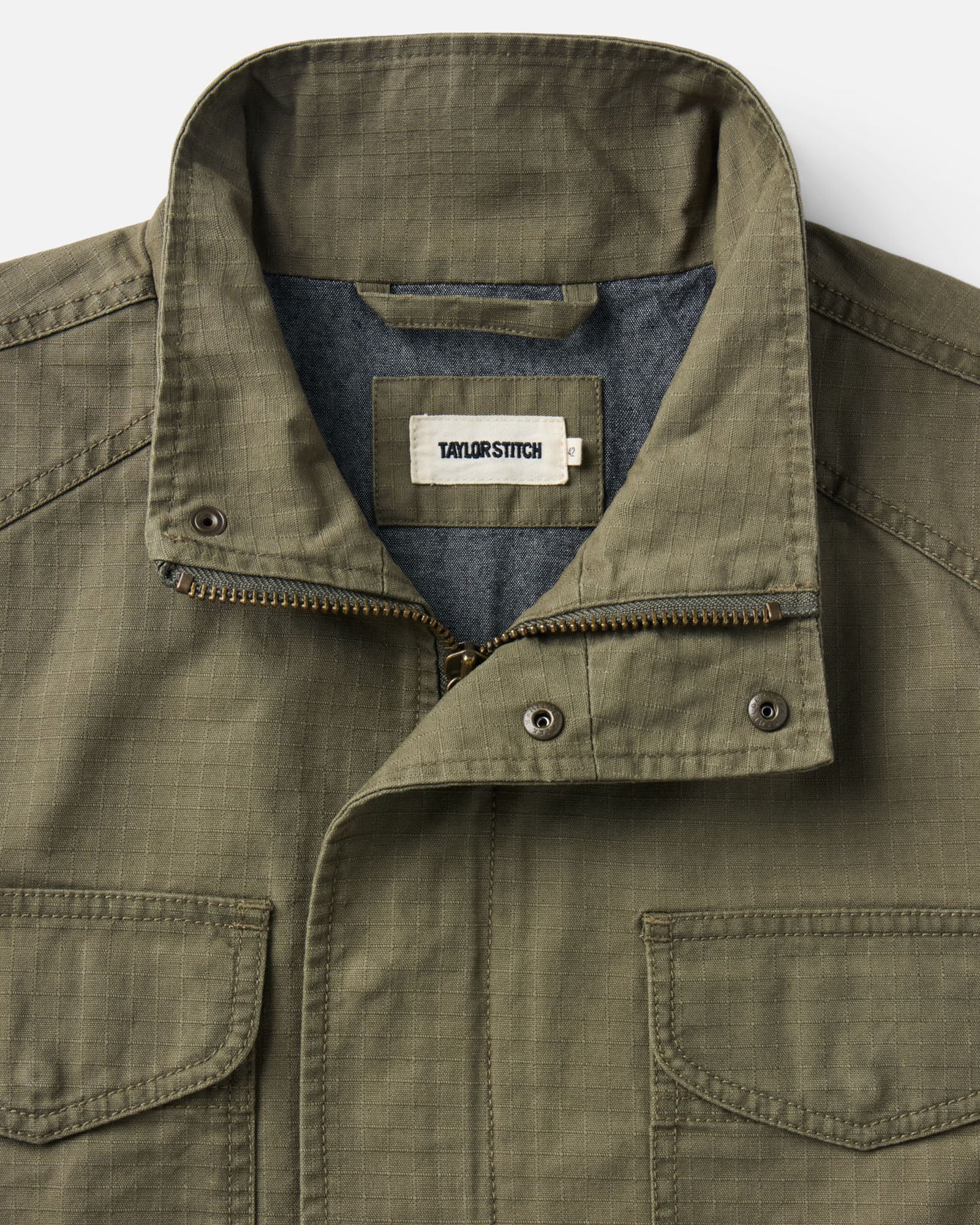 material shot of the collar on The Field Jacket in Burnt Olive Ripstop, Outerwear by Taylor Stitch