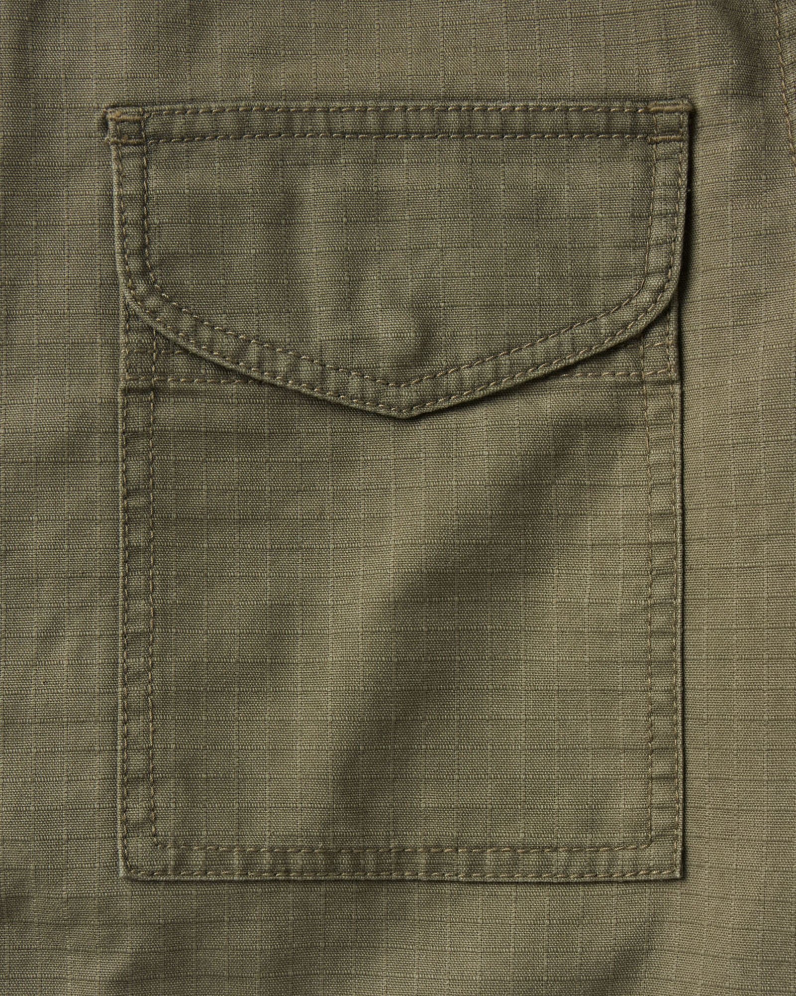 material shot of the pocket on The Field Jacket in Burnt Olive Ripstop, Outerwear by Taylor Stitch