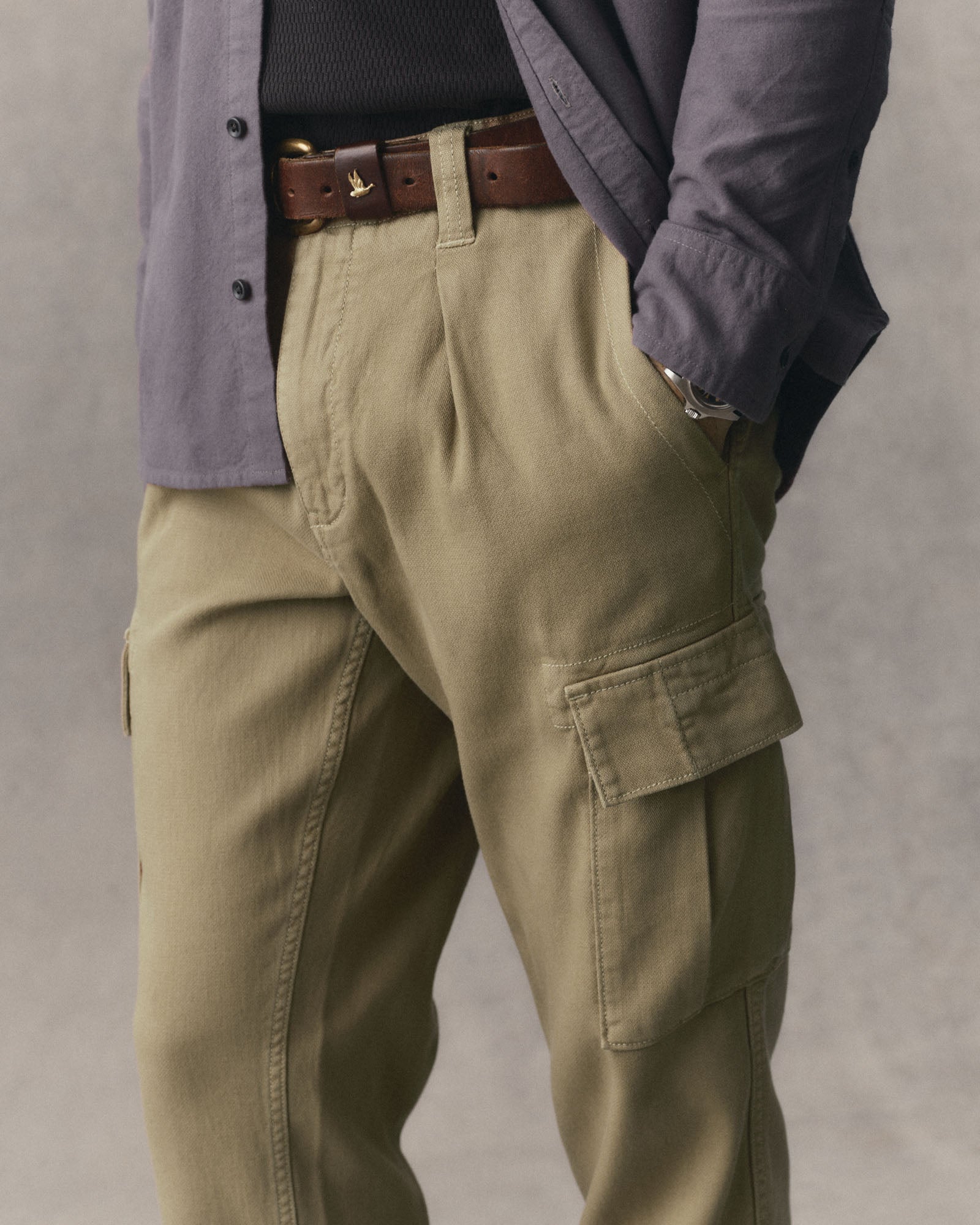 fit model with his hand in the pocket of The Forest Cargo Pant in Field Khaki Broken Twill, Bottoms by Taylor Stitch