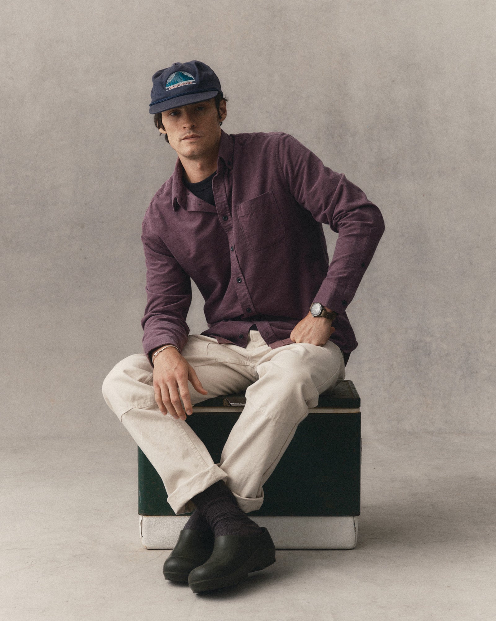 fit model sitting wearing The Jack in Heather Plum Pincord, Wovens by Taylor Stitch