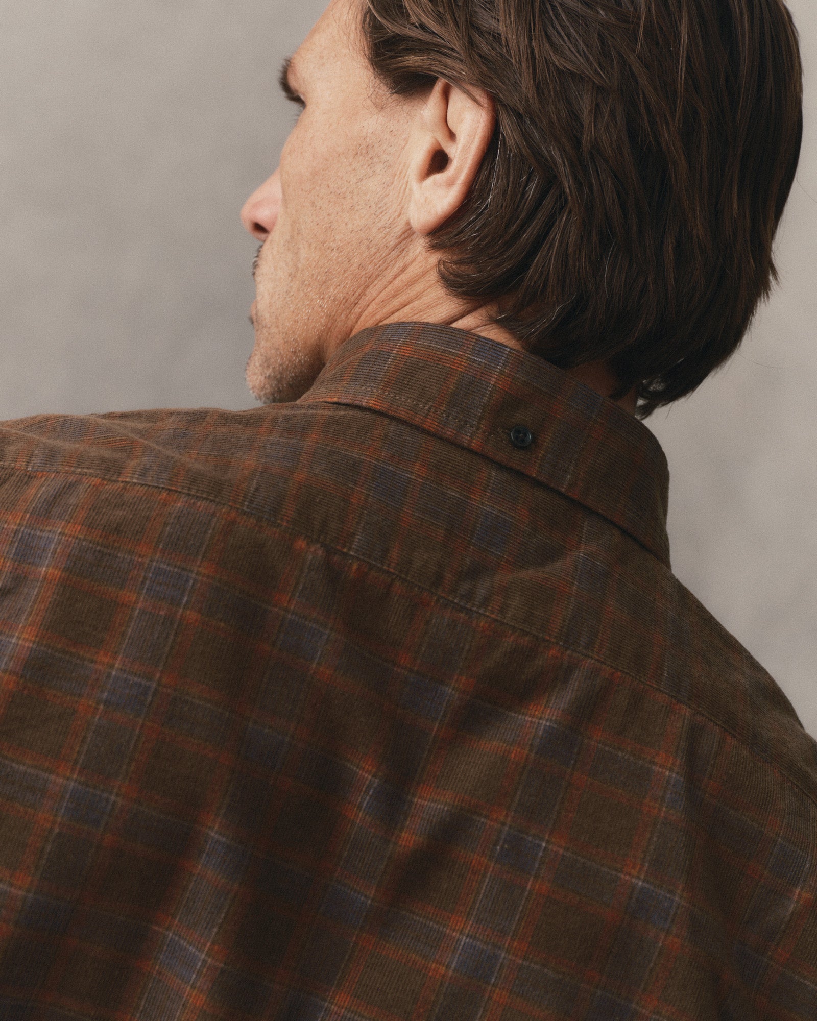 fit model showing off the back of The Jack in Mulch Check Pincord, Wovens by Taylor Stitch