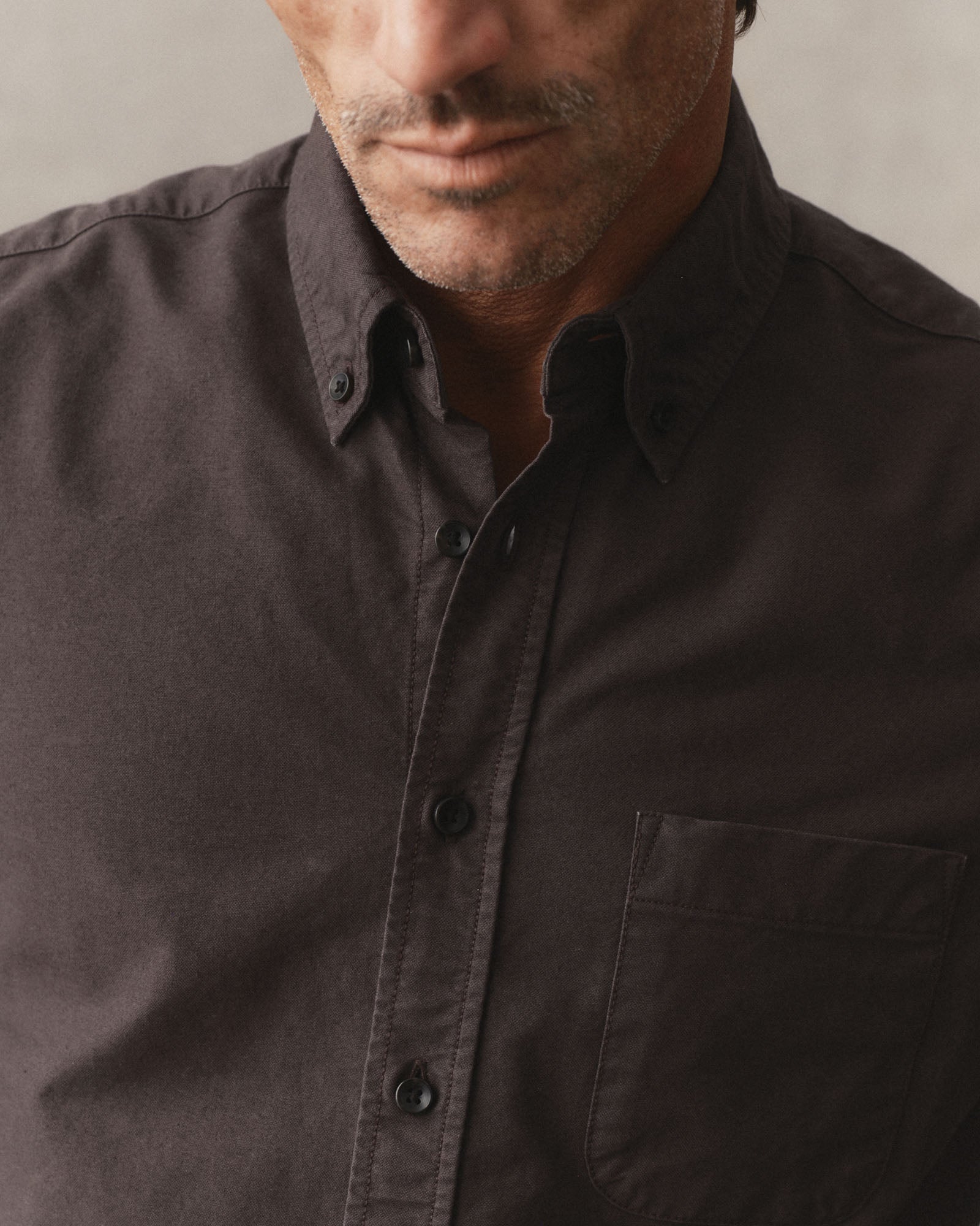 fit model showing the buttons on The Jack in Soil Oxford, Wovens by Taylor Stitch