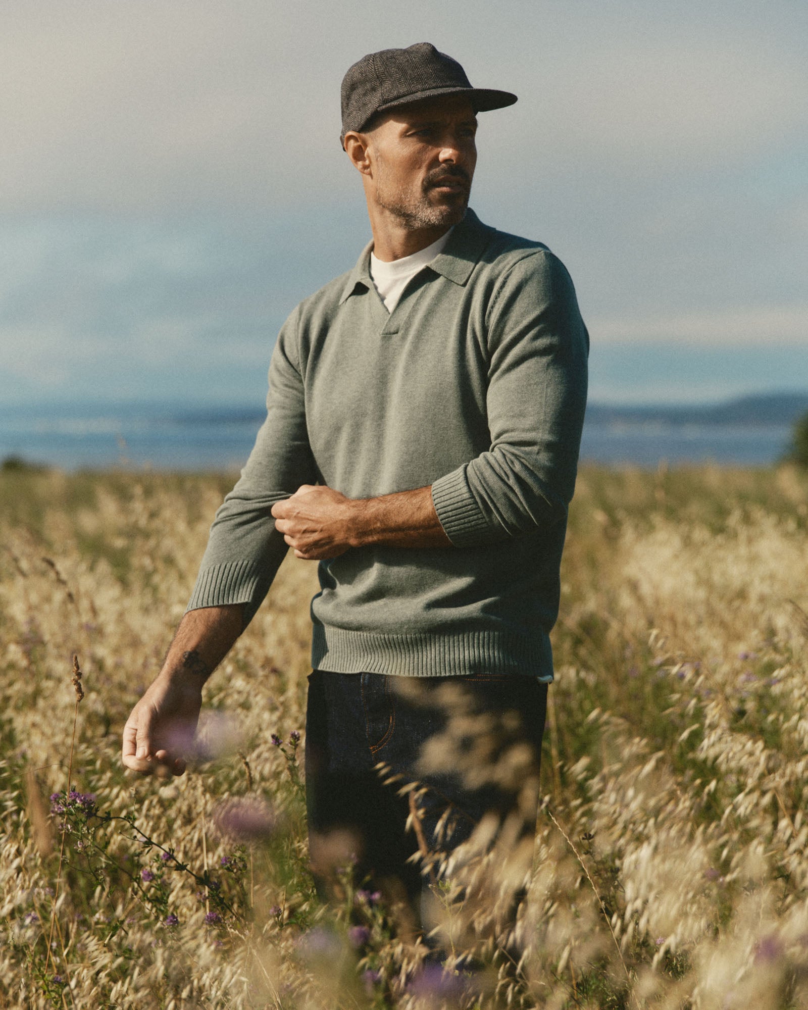 fit model showing off The Long Sleeve Valencia Sweater Polo in Olive, Sweaters by Taylor Stitch