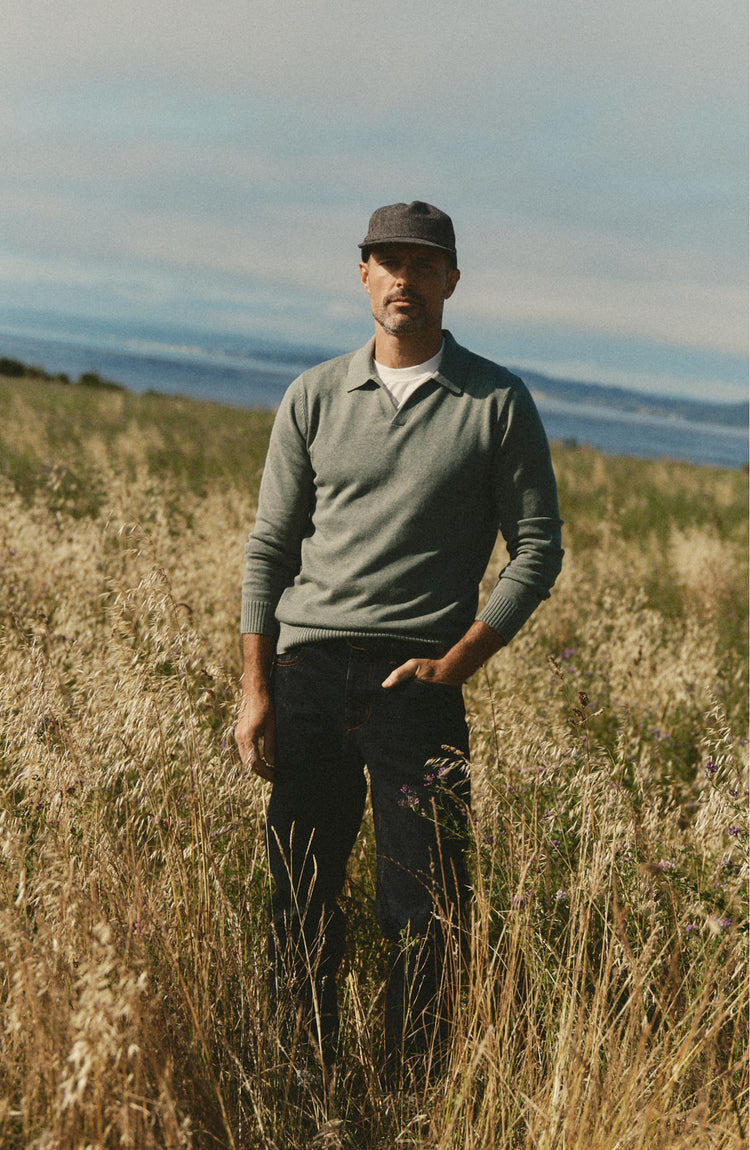 fit model posing in The Long Sleeve Valencia Sweater Polo in Olive