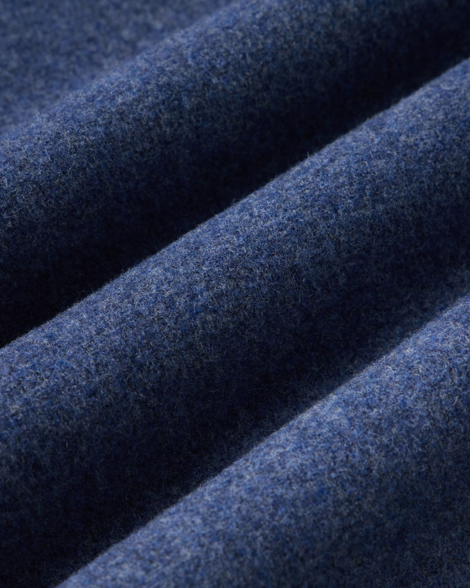 material shot of the fabric on The Maritime Shirt Jacket in Heather Navy Wool, Outerwear by Taylor Stitch