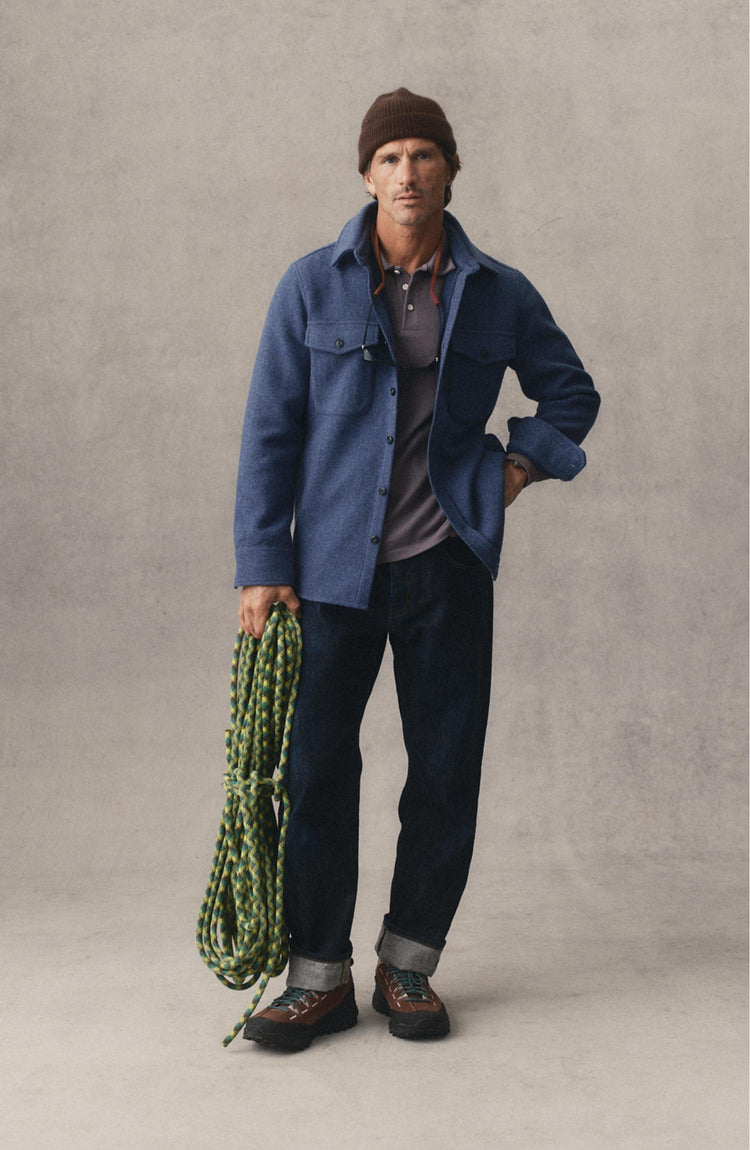 fit model posing in The Maritime Shirt Jacket in Heather Navy Wool