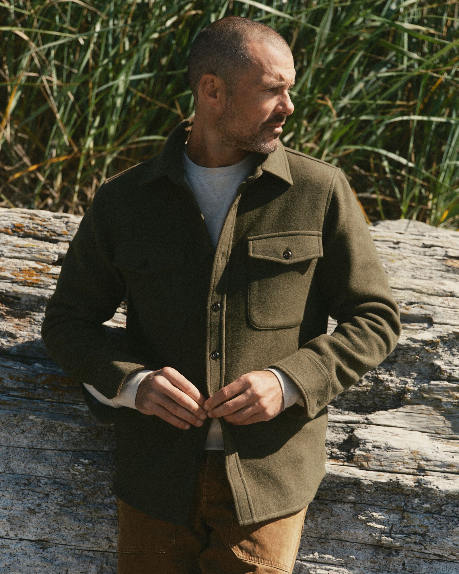 fit model buttoning up The Maritime Shirt Jacket in Heather Olive Wool, Outerwear by Taylor Stitch