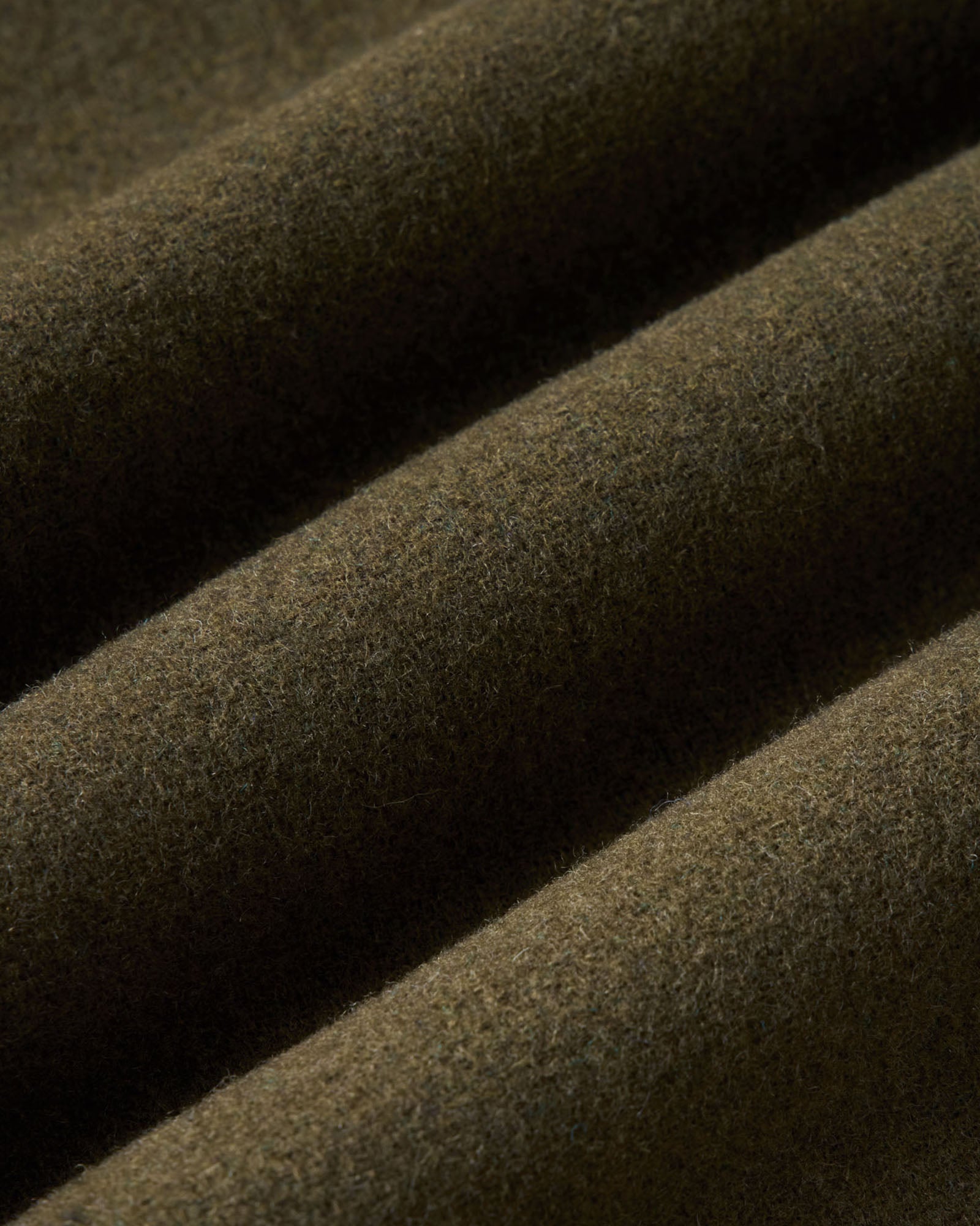 material shot of the fabric on The Maritime Shirt Jacket in Heather Olive Wool, Outerwear by Taylor Stitch