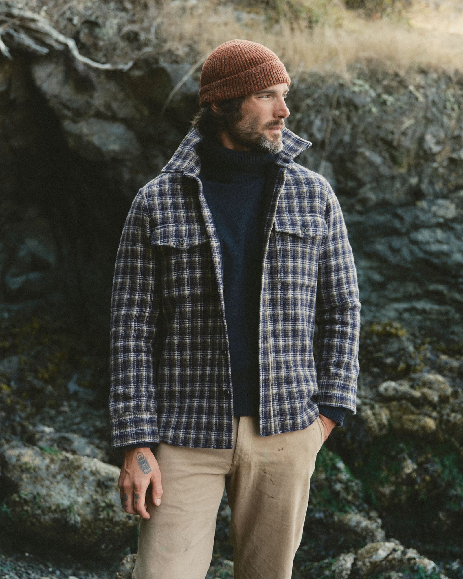 fit model posing in The Maritime Shirt Jacket in Navy Shadow Plaid Wool, Outerwear by Taylor Stitch