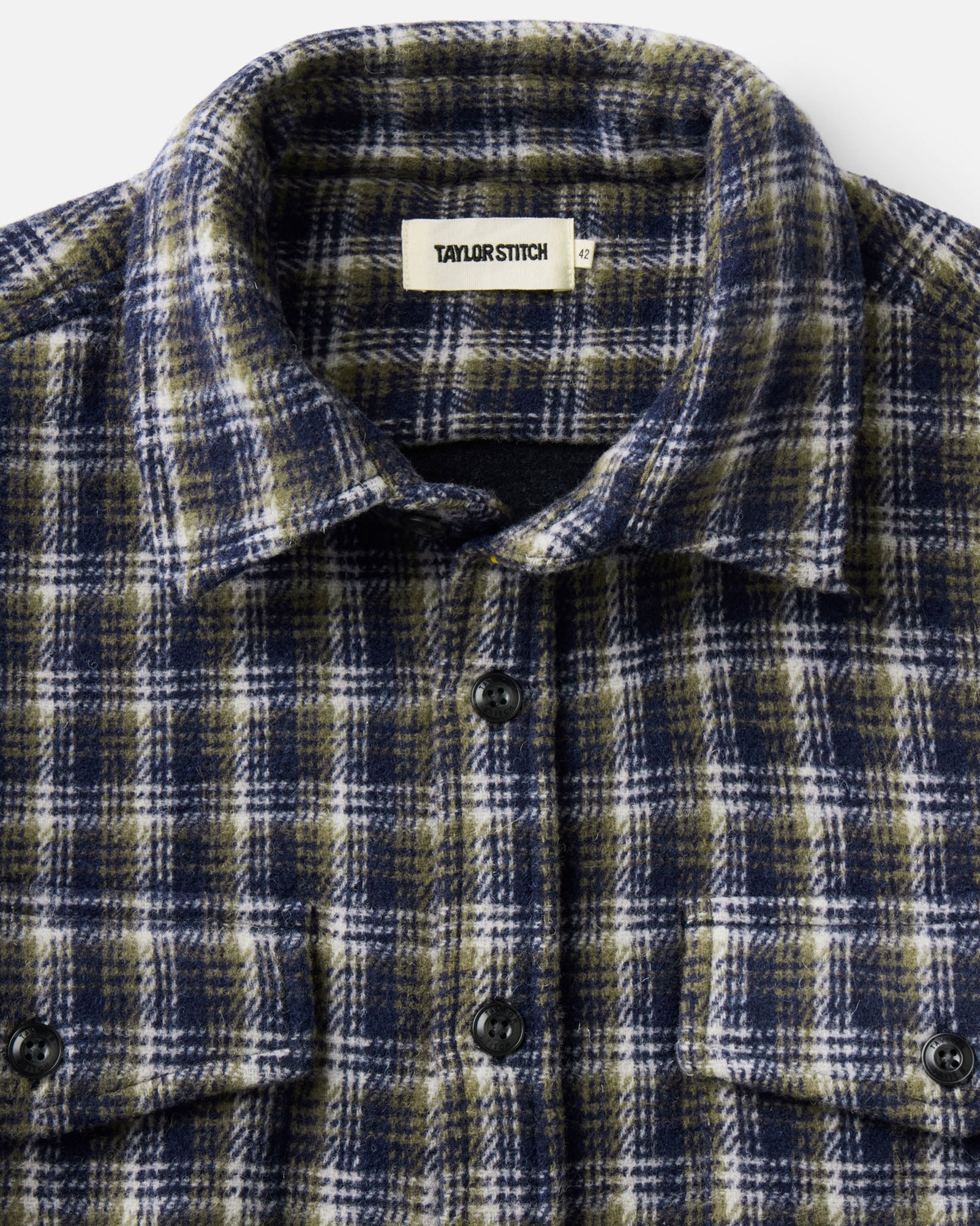 material shot of the collar on The Maritime Shirt Jacket in Navy Shadow Plaid Wool, Outerwear by Taylor Stitch