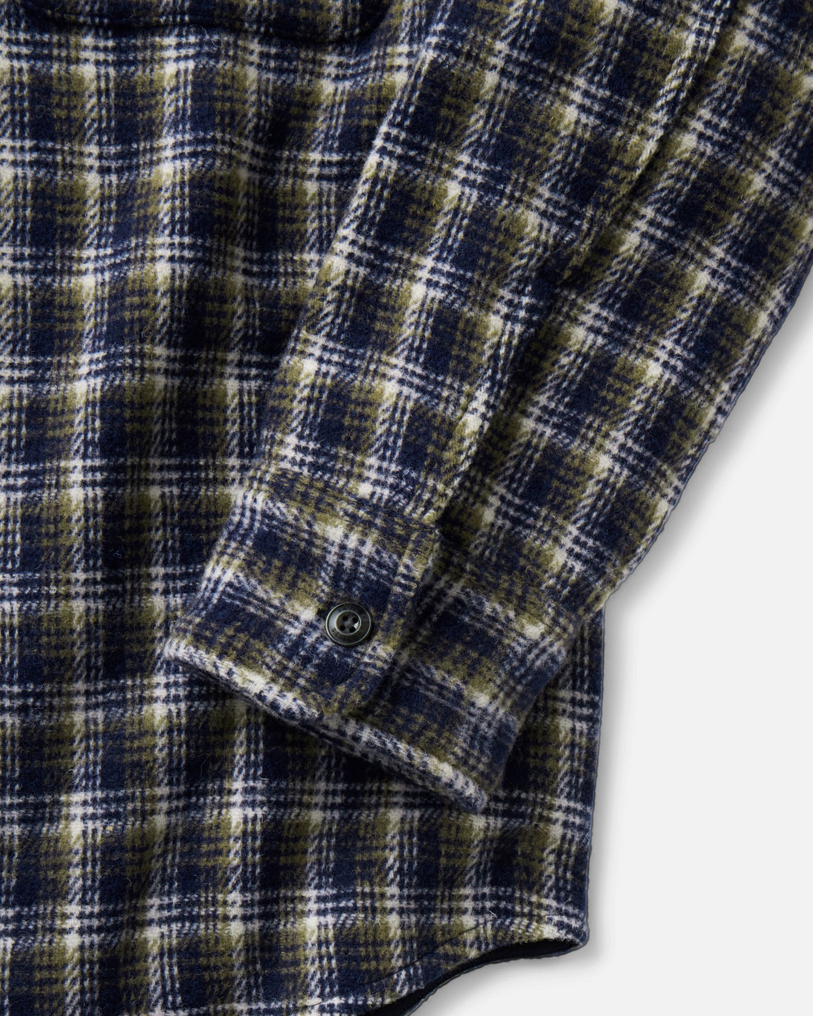 material shot of the sleeve on The Maritime Shirt Jacket in Navy Shadow Plaid Wool, Outerwear by Taylor Stitch