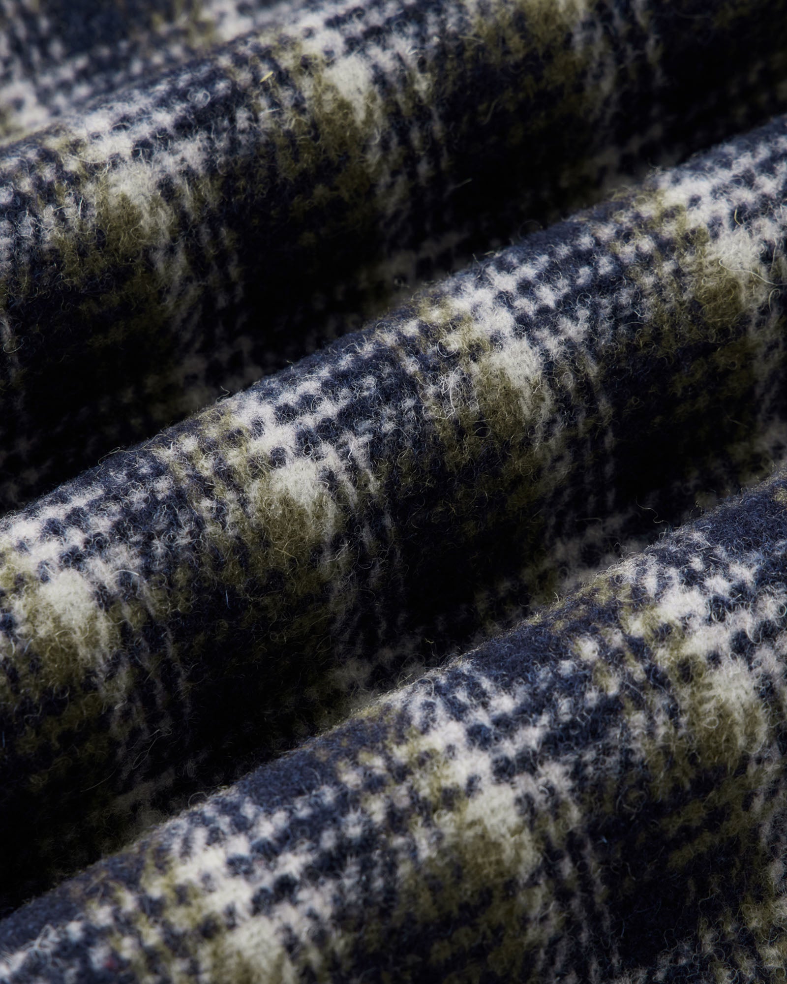 material shot of the fabric on The Maritime Shirt Jacket in Navy Shadow Plaid Wool, Outerwear by Taylor Stitch
