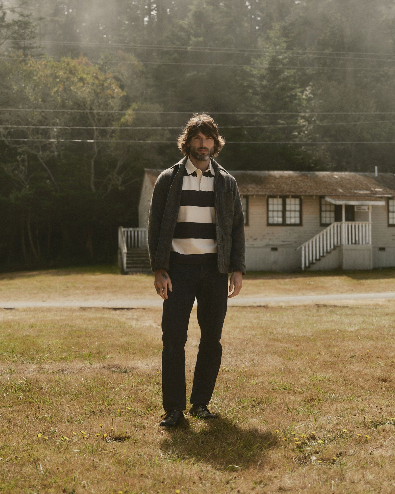 fit model posing in The Ojai Jacket in Rust Check Harris Tweed Wool, Outerwear by Taylor Stitch